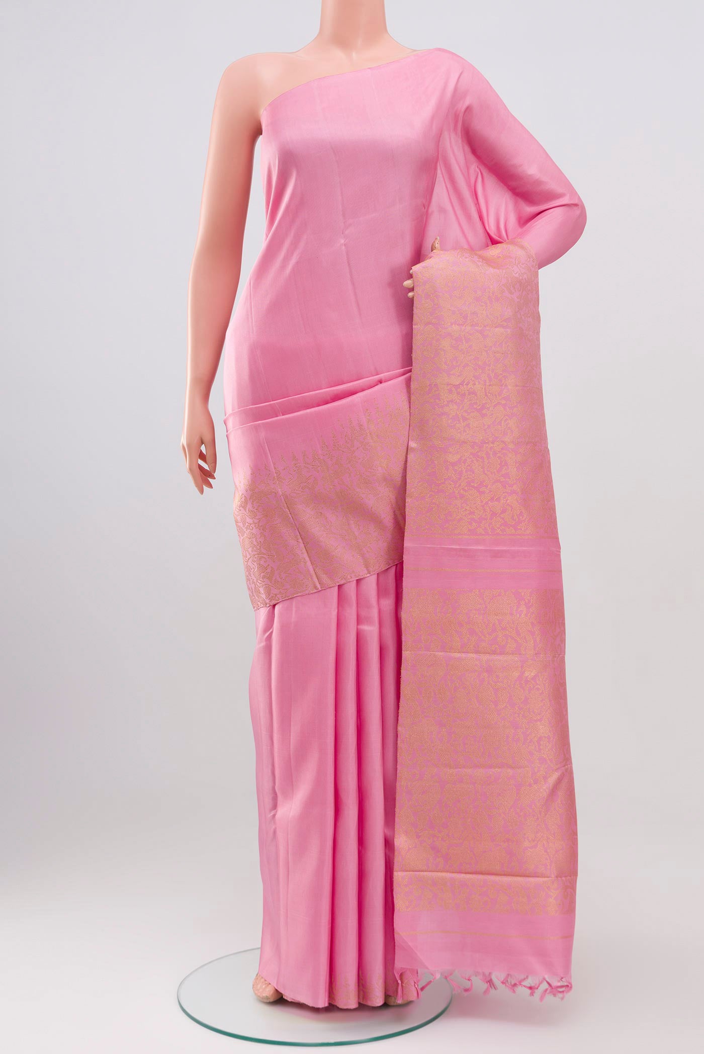 Pure Silk Pure Zari Pink Kanjivaram Saree with Zari Brocade on the body and Without Border.  displayed on a mannequin