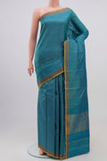 Blue Kanchipuram Silk Saree with Checked design on the body and Zari Border.  displayed on a mannequin