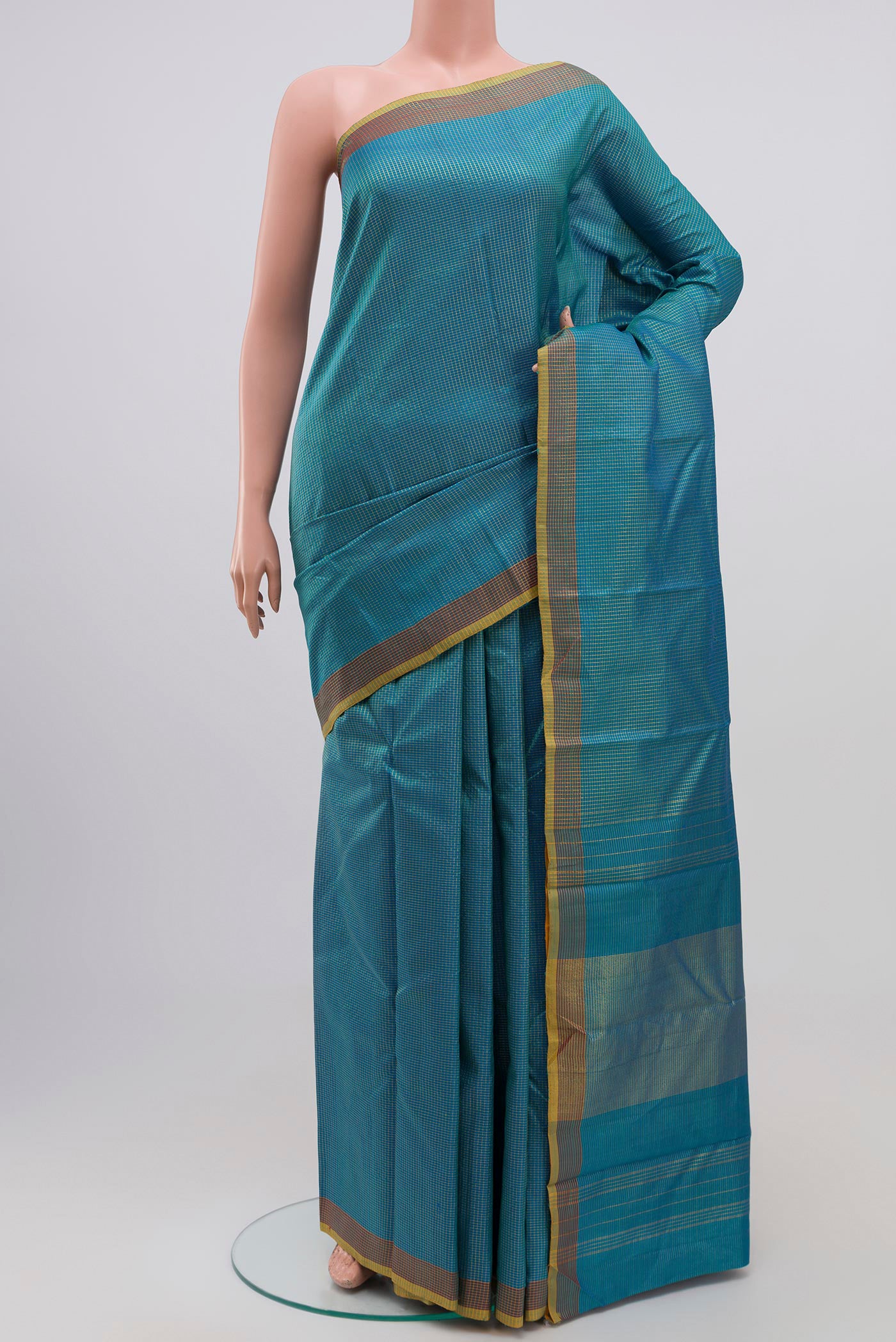 Blue Kanchipuram Silk Saree with Checked design on the body and Zari Border.  displayed on a mannequin