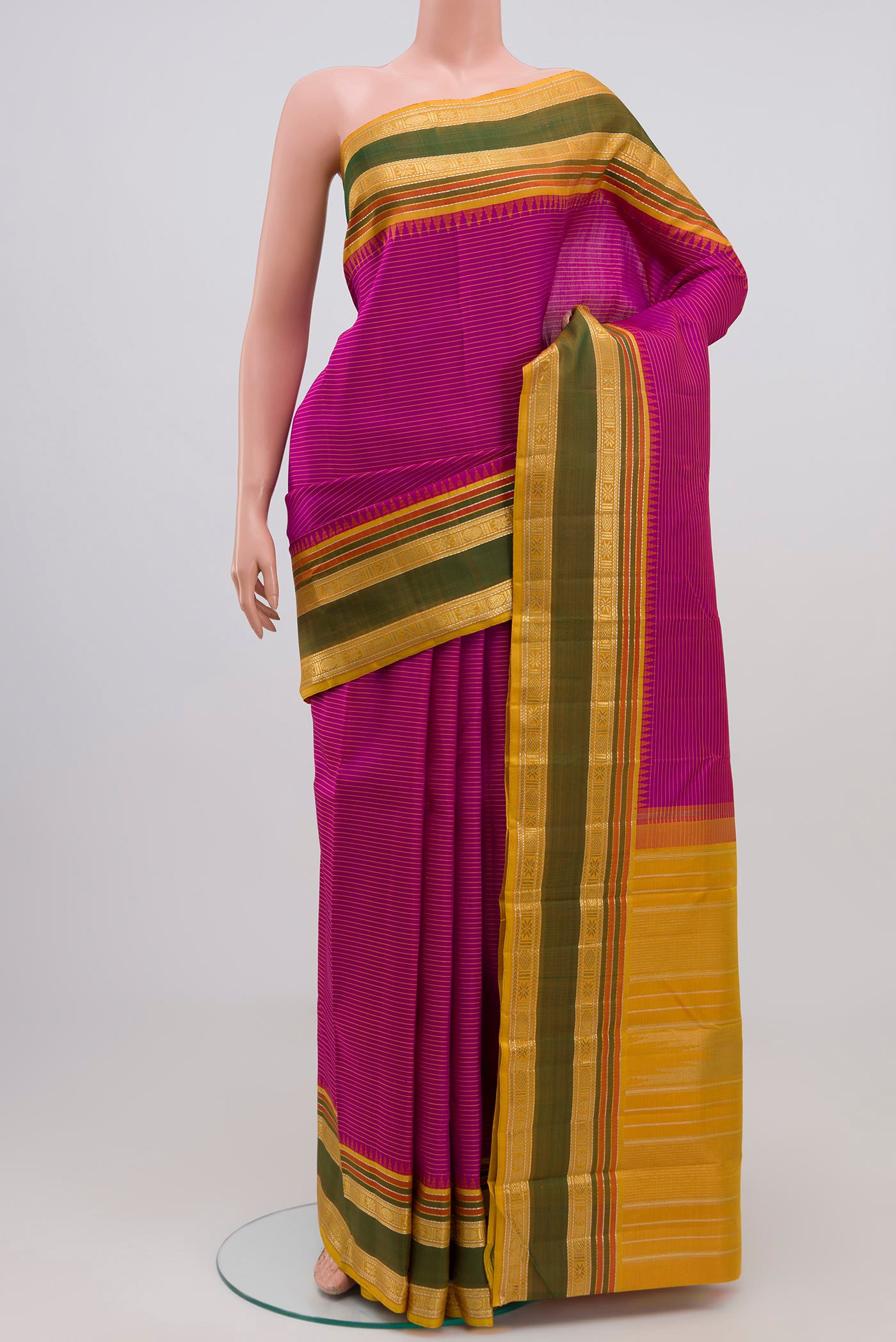 Pure Silk Pure Zari Purple Kanchipuram Saree with Stripes on the body and Zari Border.  displayed on a mannequin