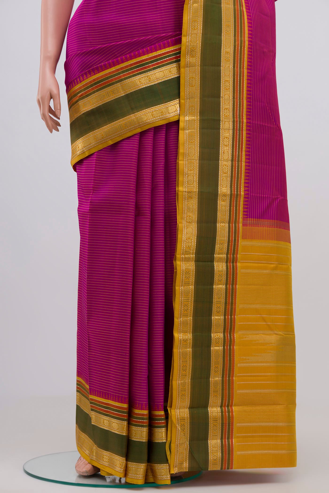 Pleats and pallu of Pure Silk Pure Zari Purple Kanchipuram Saree with Stripes on the body and Zari Border. 