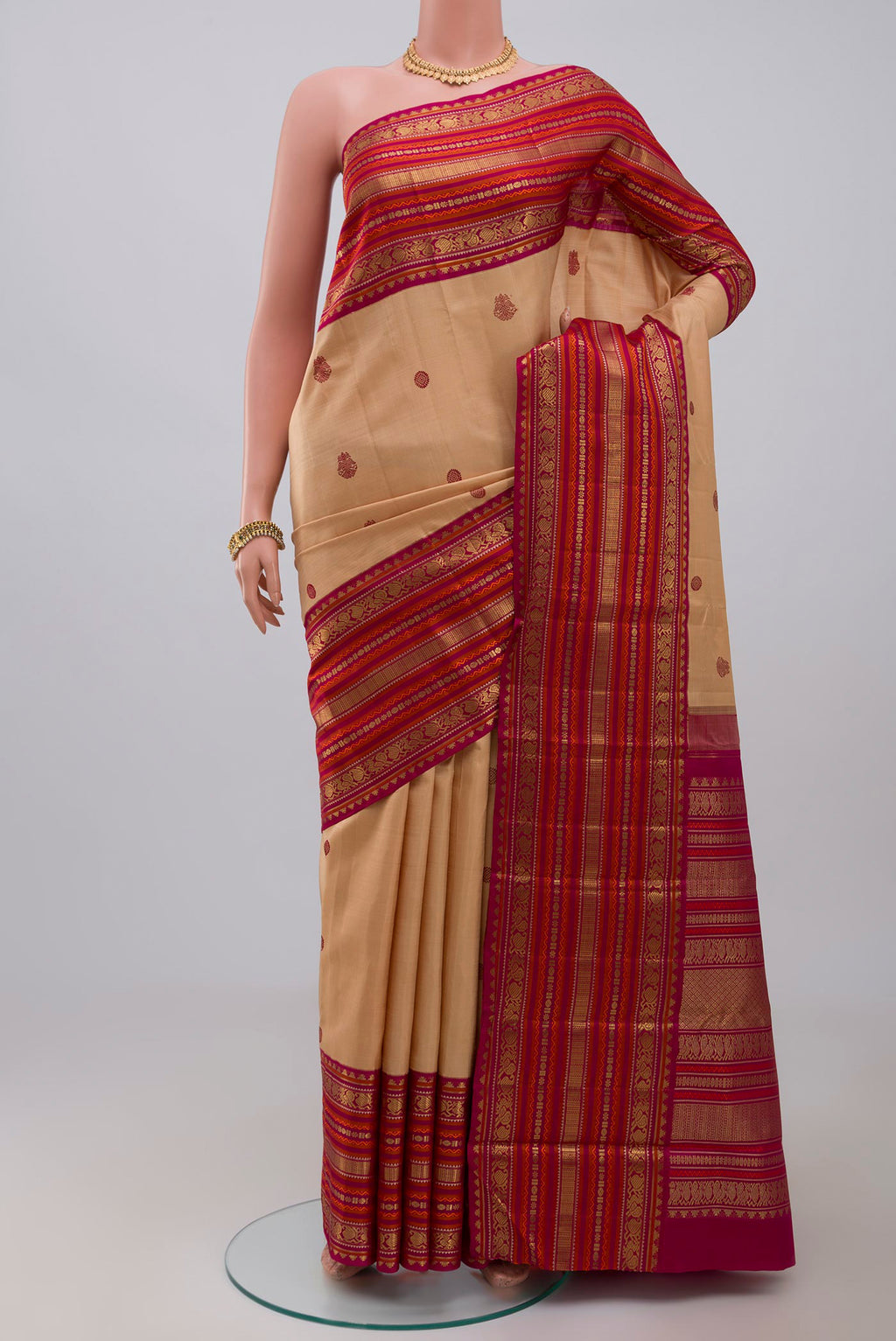 Pure Silk Pure Zari Cream Kanjivaram Saree with Thread Butta on the body and Zari Border.  displayed on a mannequin