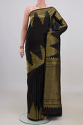 Pure Silk Black Kanchipuram Saree with Plain Body and Temple Border.  displayed on a mannequin