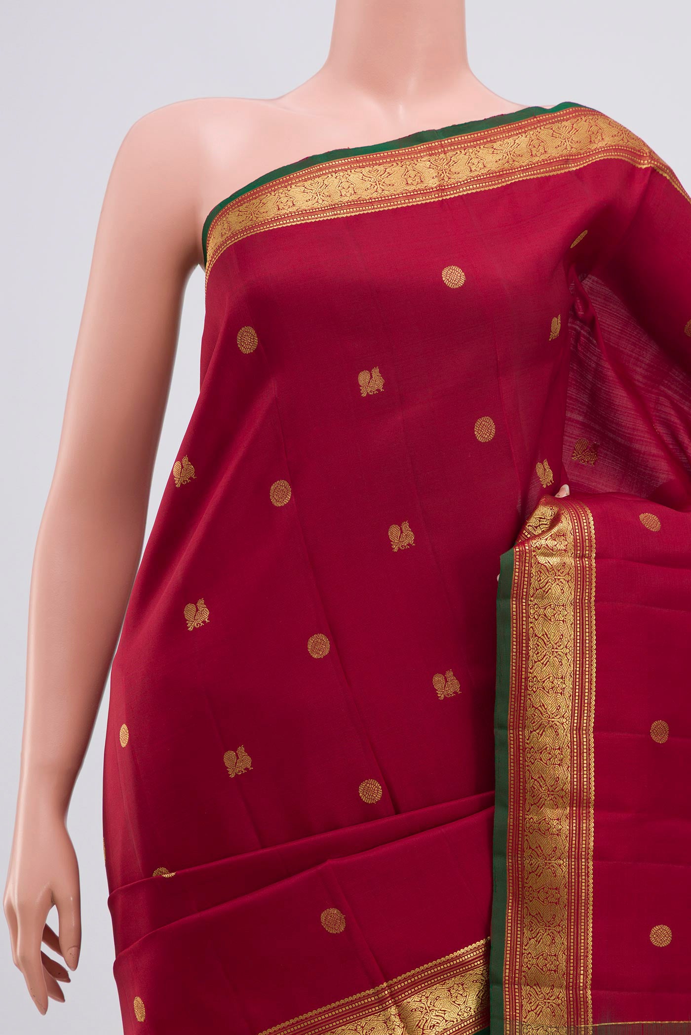 Border image of Maroon Kanchipuram Saree with Zari Butta on the body and Zari Border. 