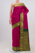 Dark Pink Kanchipuram Silk Saree with Zari Butta on the body and Zari Border.  displayed on a mannequin