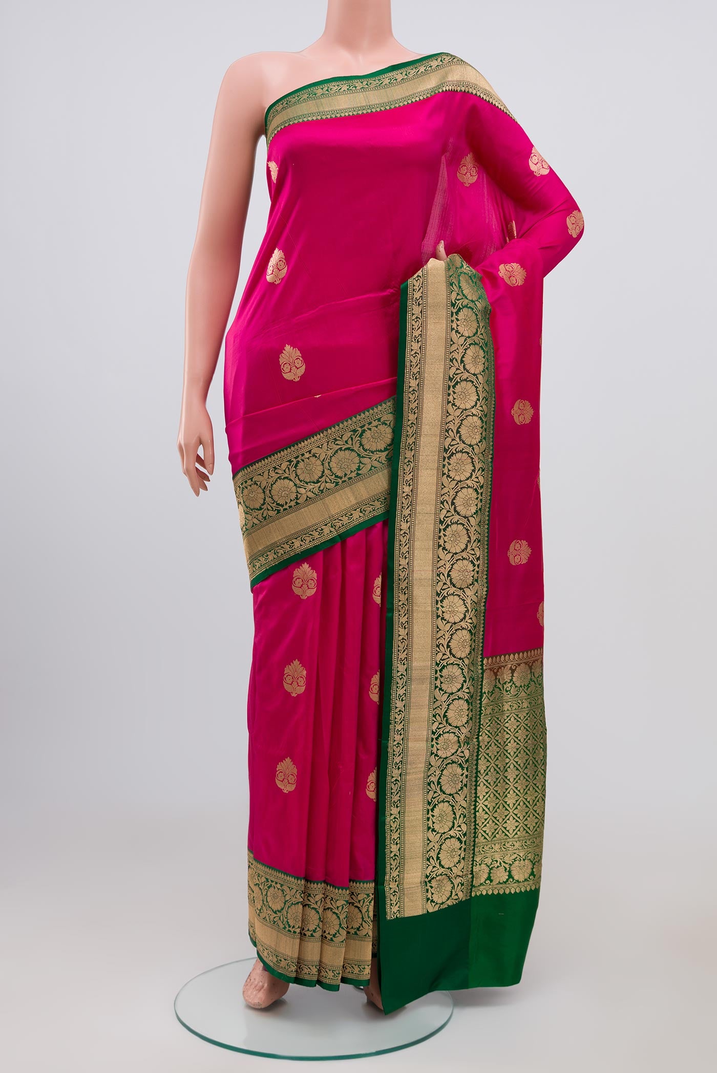 Pink Banarasi Katan Silk Saree with Zari Butta on the body and Zari Border.  displayed on a mannequin