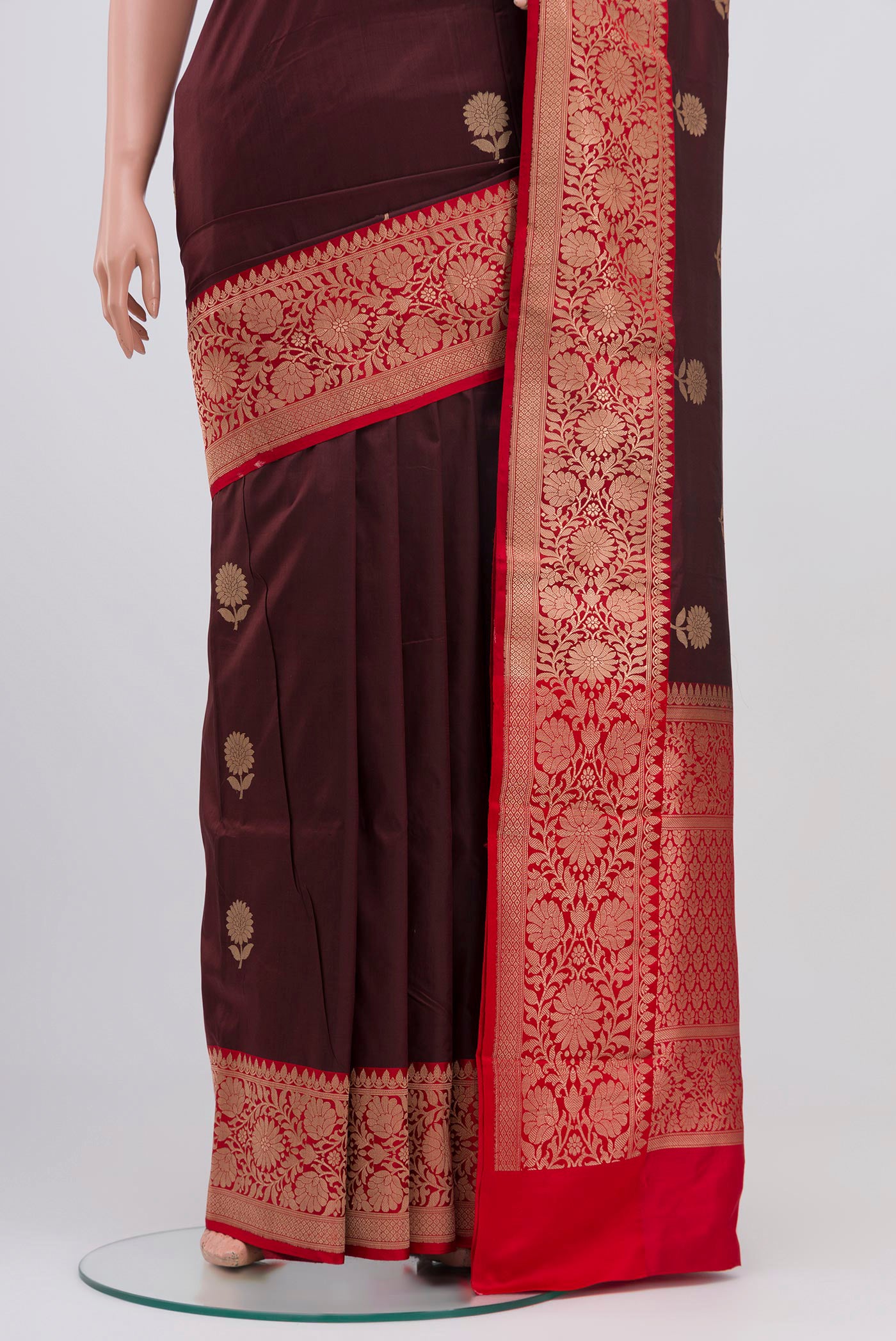 Pleats and pallu of Maroon Banarasi Katan Silk Saree with Zari Butta on the body and Zari Border. 