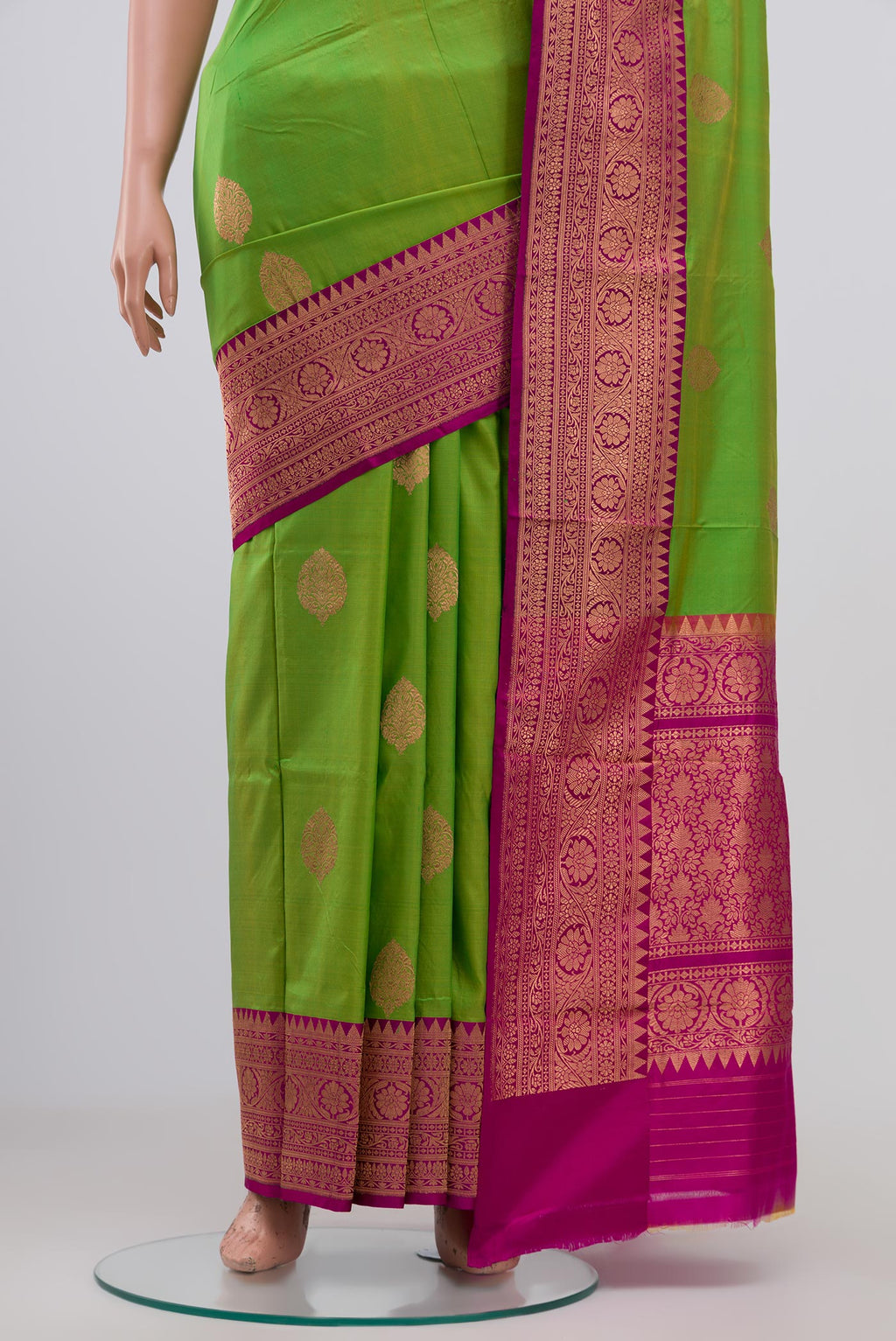 Pleats and pallu of Parrot Green Banarasi Katan Silk Saree with Zari Butta on the body and Zari Border. 