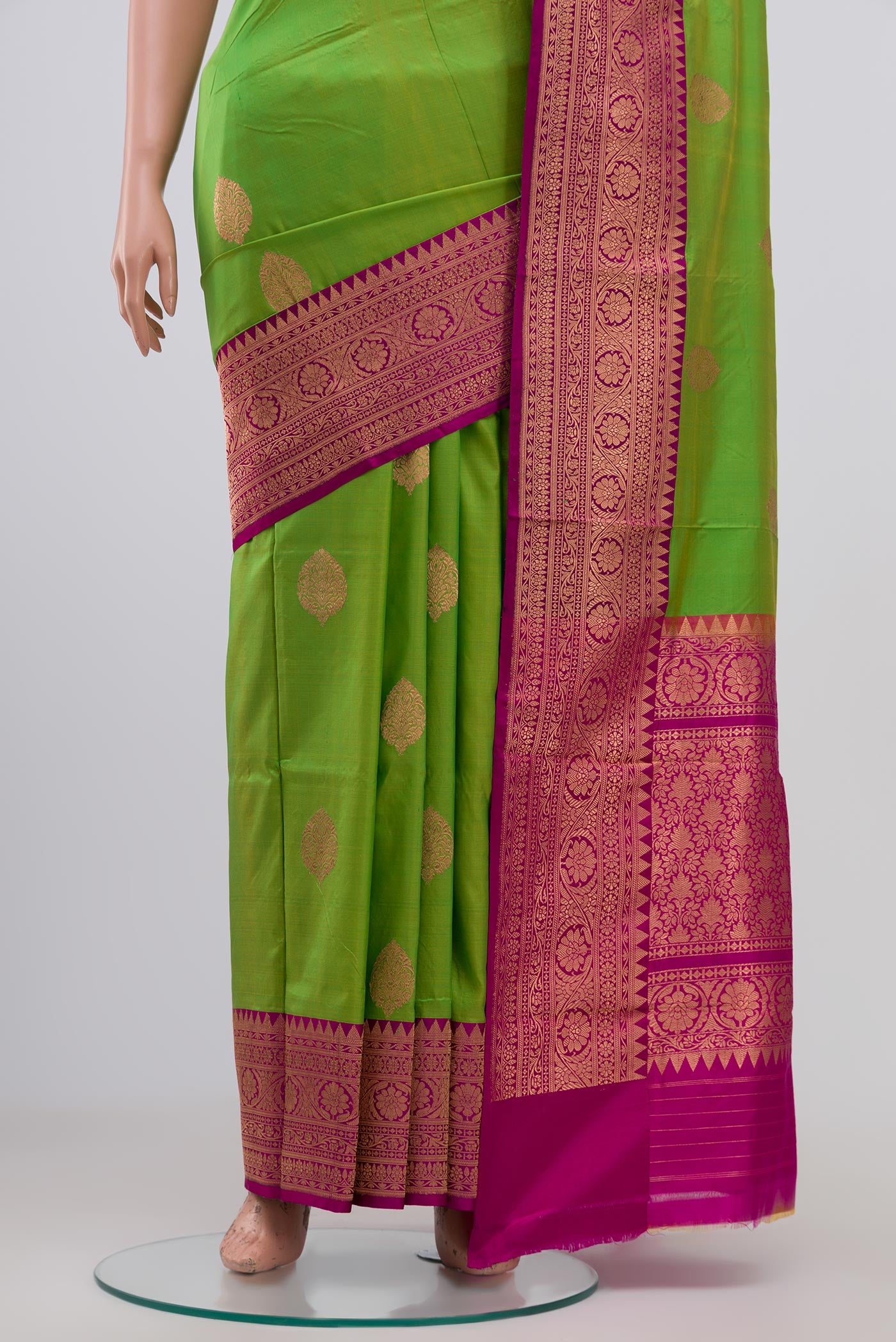Pleats and pallu of Parrot Green Banarasi Katan Silk Saree with Zari Butta on the body and Zari Border. 