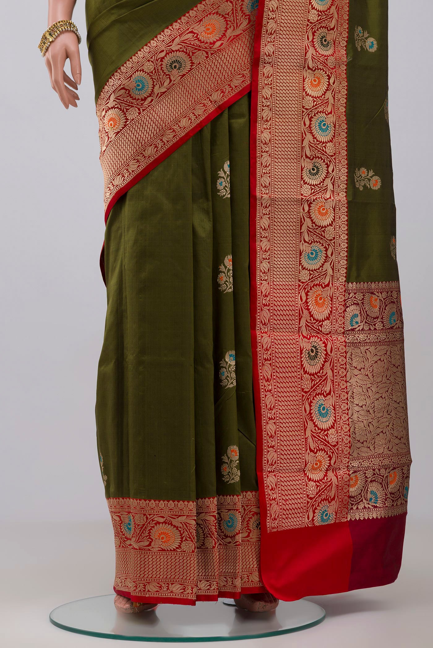 Pleats and pallu of Mehandi Green Banarasi Katan Silk Saree with Zari Butta on the body and Zari Border. 