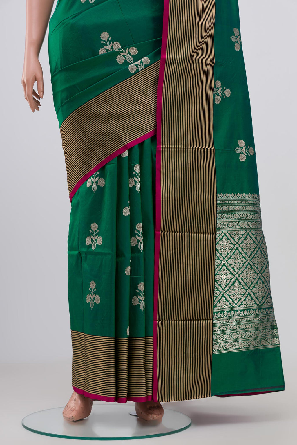 Pleats and pallu of Green Banarasi Katan Silk Saree with Zari Butta on the body and Thin Zari Line. 