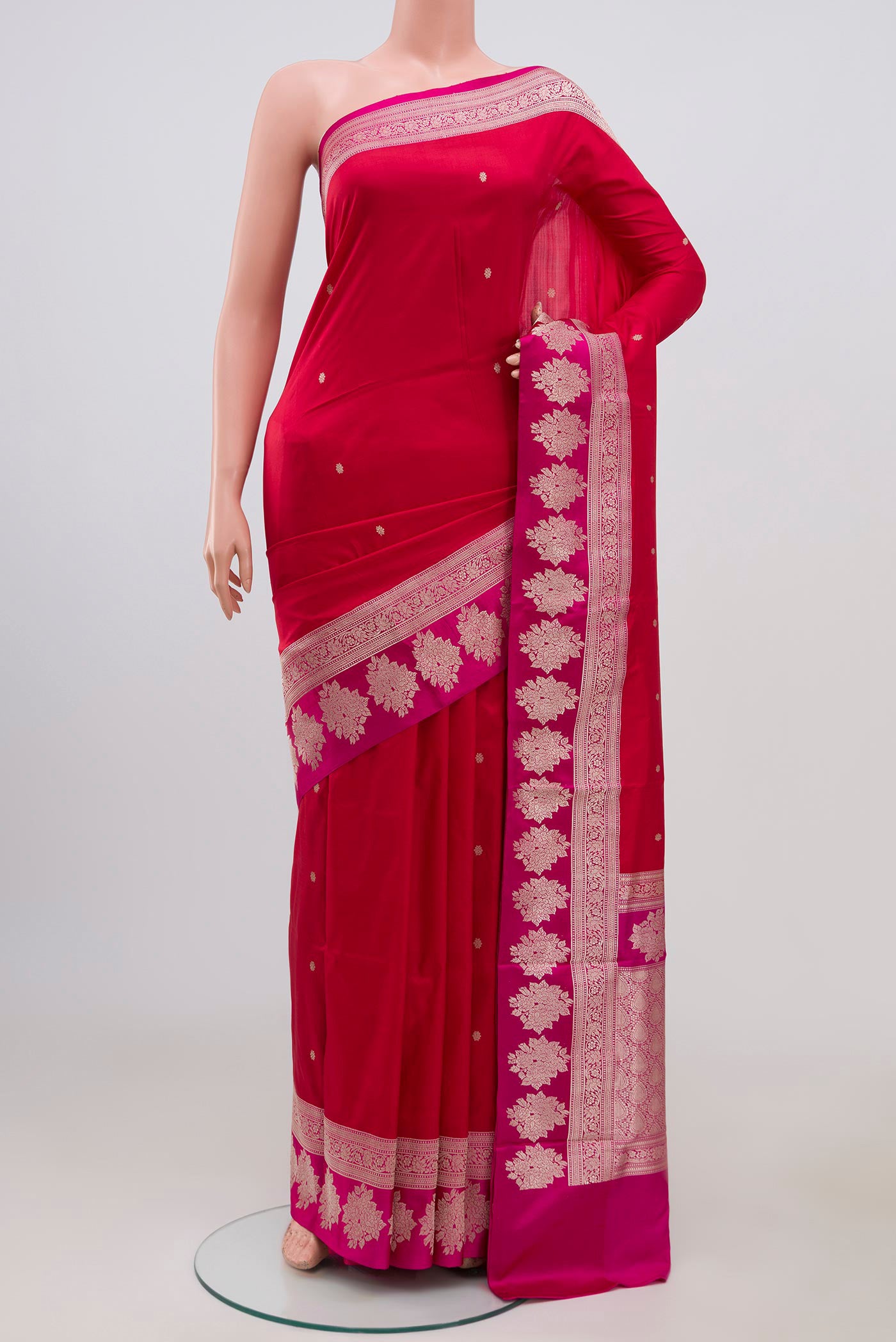 Red Banarasi Katan Silk Saree with Zari Butta on the body and Fancy Border.  displayed on a mannequin