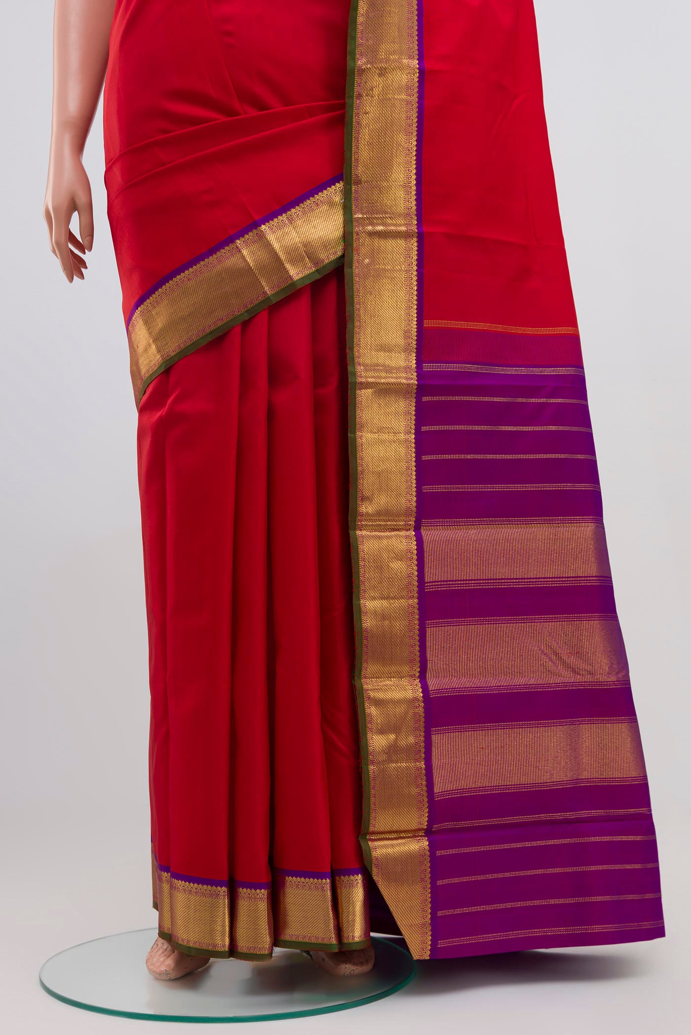Pleats and pallu of Pure Silk Pure Zari Red Kanchipuram Saree with Plain Body and Zari Border. 