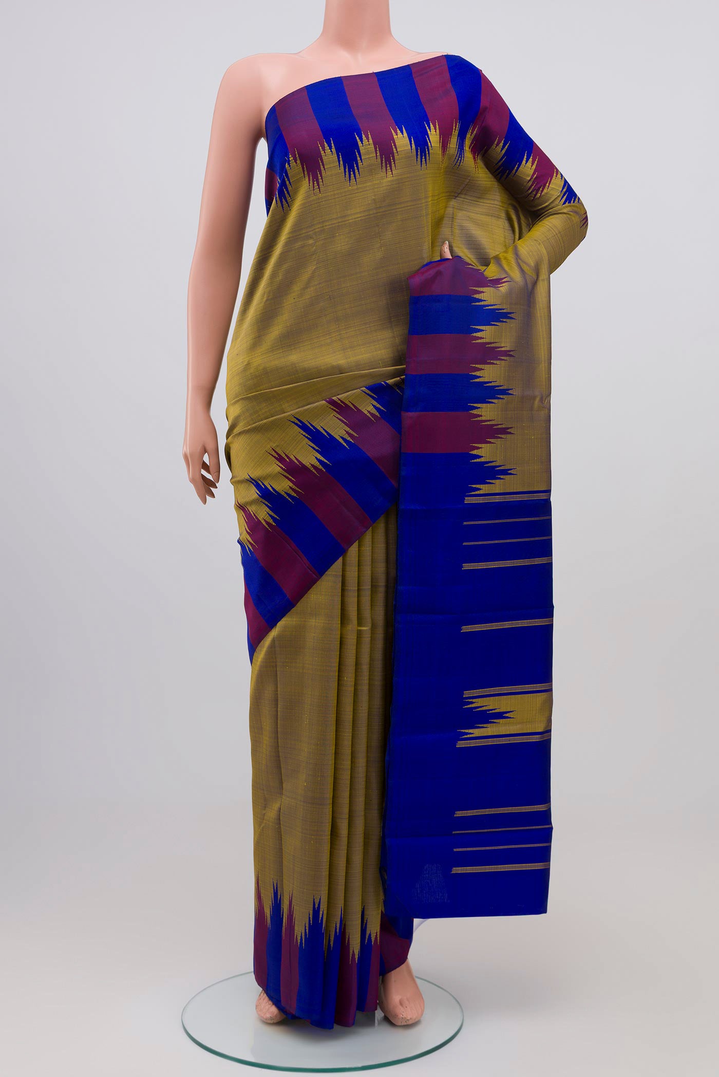 Green Dual Tone Kanchipuram Silk Saree with Plain Body and Temple Border.  displayed on a mannequin