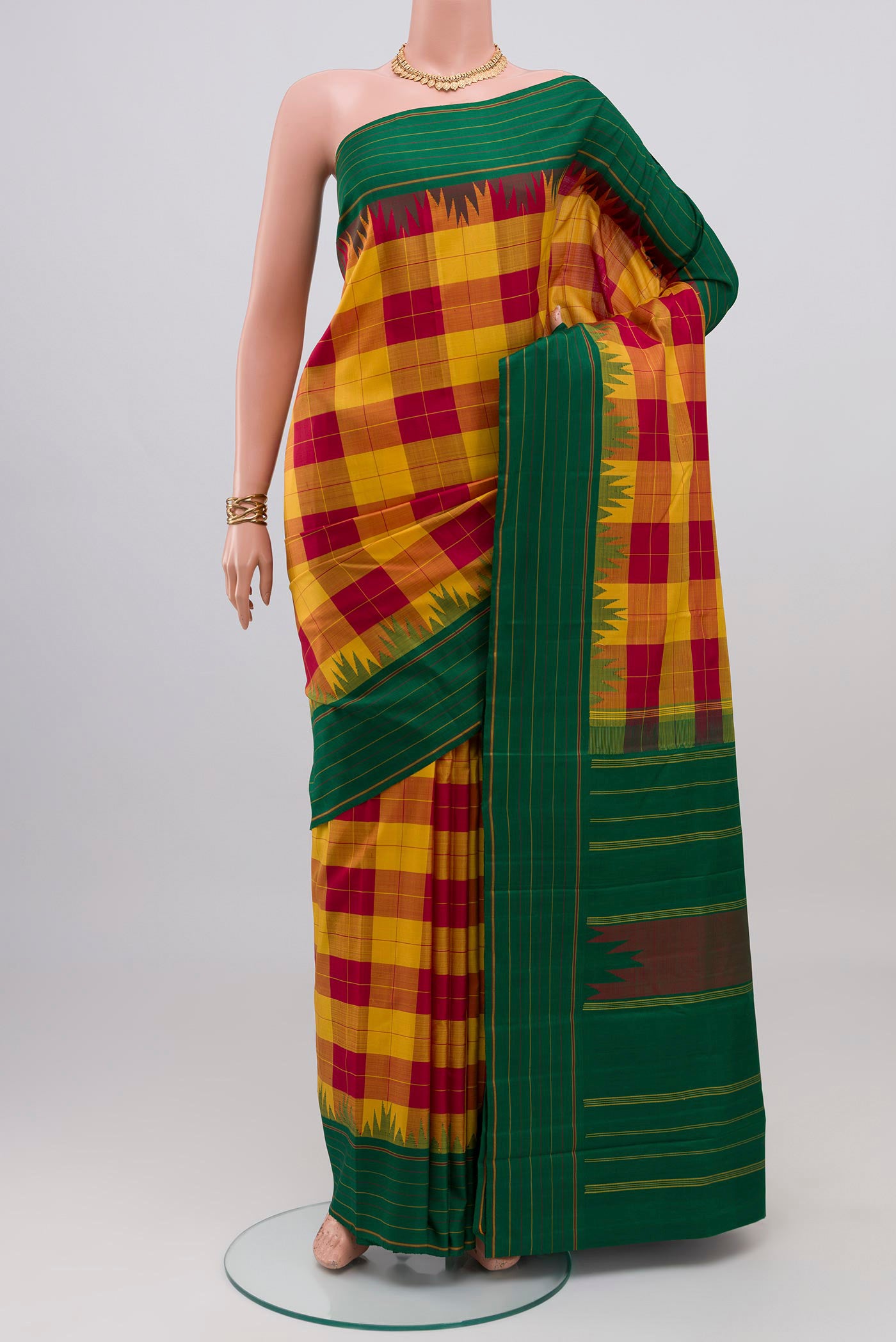 Multi Color Kanjivaram Silk Saree with Checked design on the body and Plain Border.  displayed on a mannequin