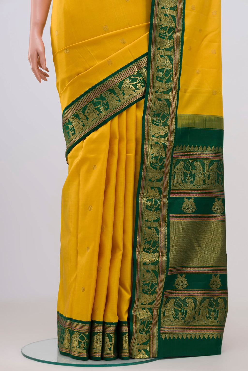 Pleats and pallu of Pure Silk Pure Zari Yellow Kanjivaram Saree with Zari Butta on the body and Zari Border. 