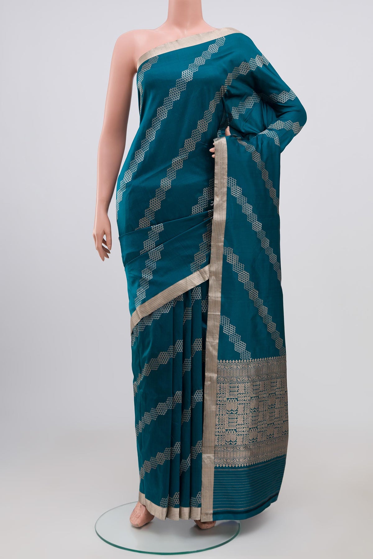 Blue Banarasi Katan Silk Saree with Fancy on the body and Thin Zari Line.  displayed on a mannequin
