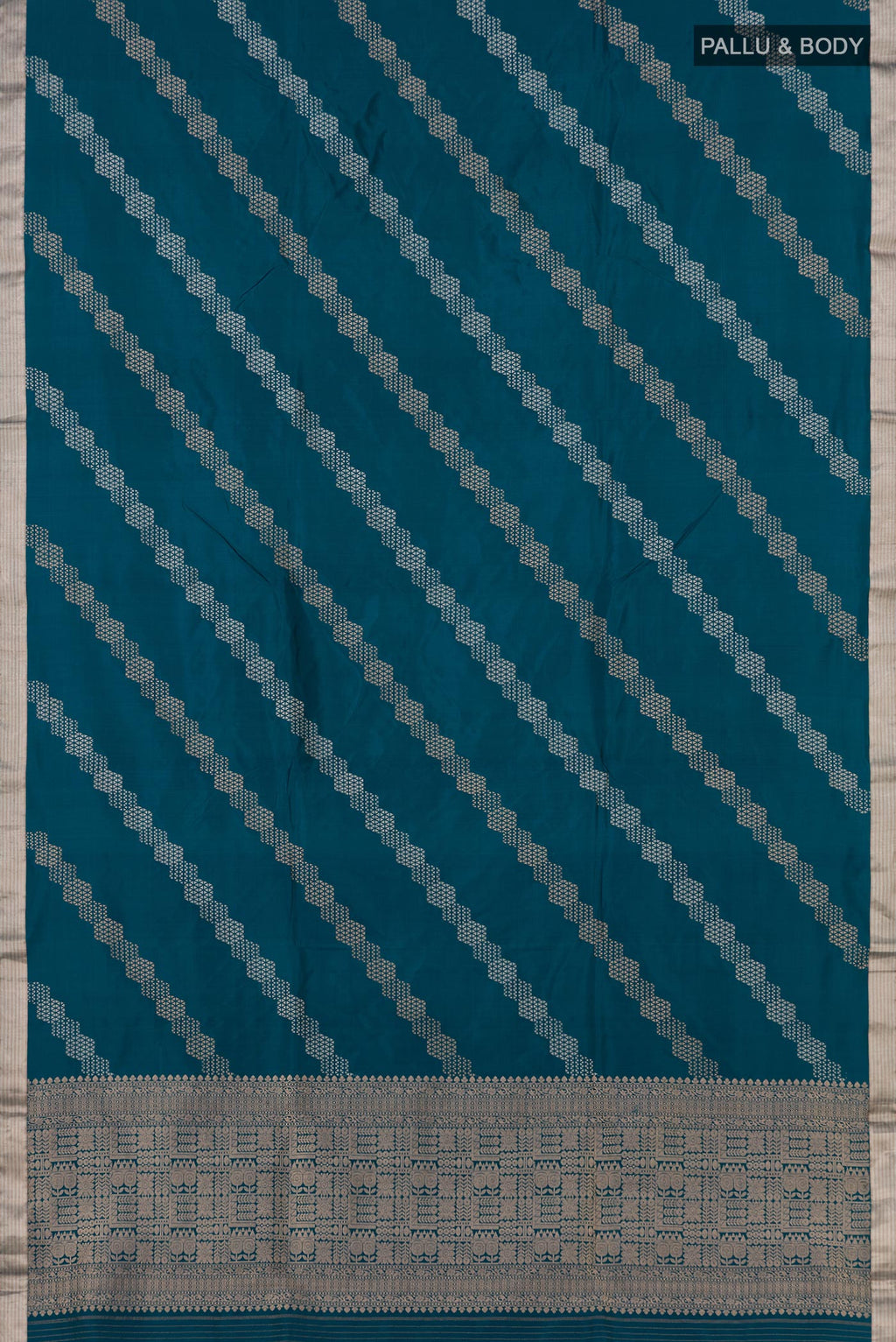 Flat view of Blue Banarasi Katan Silk Saree with Fancy on the body and Thin Zari Line. 