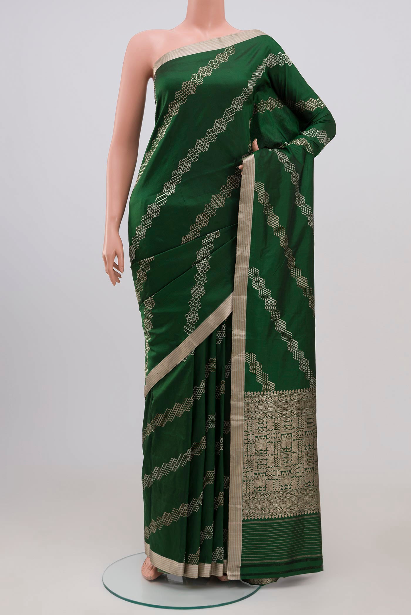 Green Banarasi Katan Silk Saree with Fancy on the body and Thin Zari Line.  displayed on a mannequin