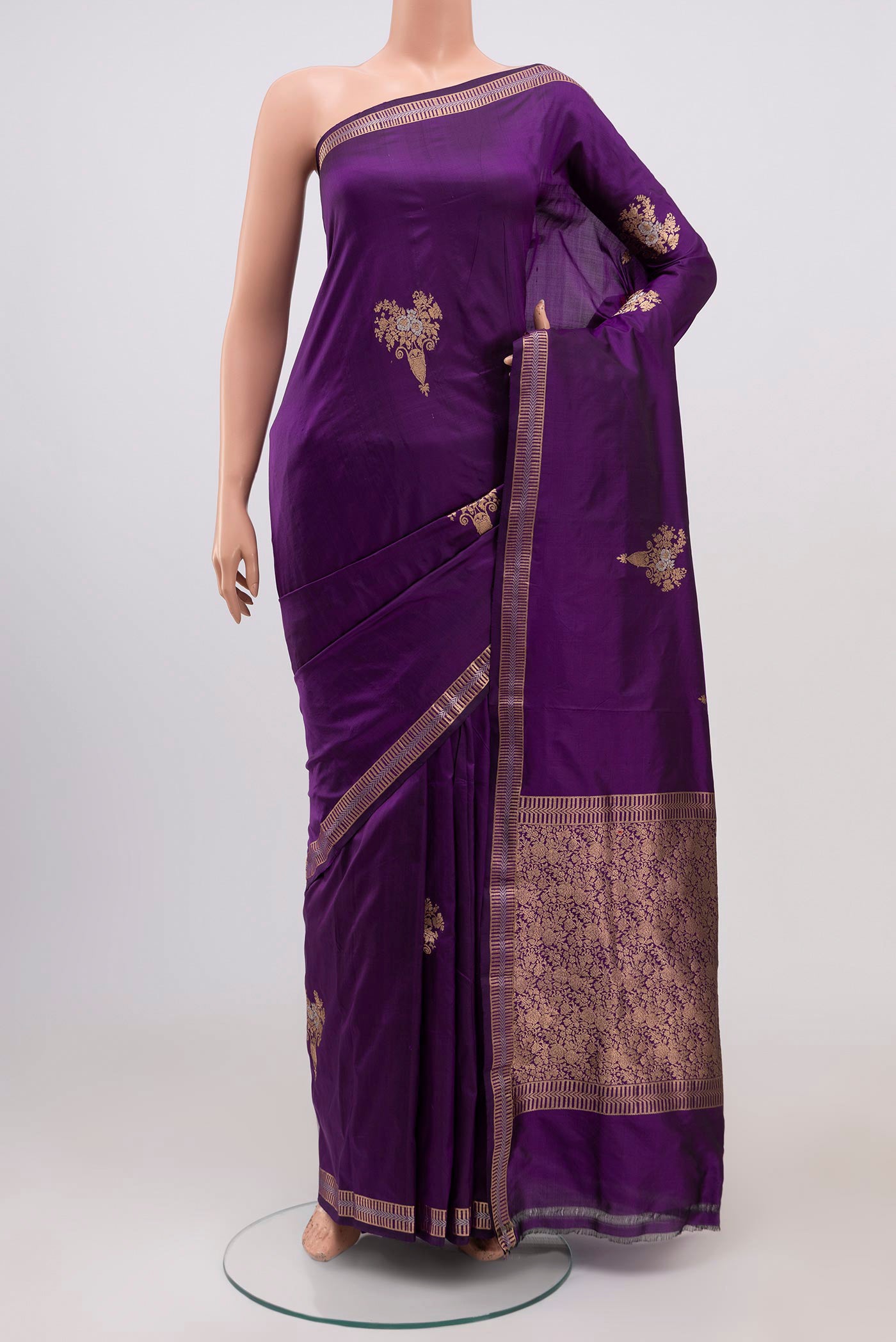 Purple Banarasi Katan Silk Saree with Zari Butta on the body and Zari Border.  displayed on a mannequin