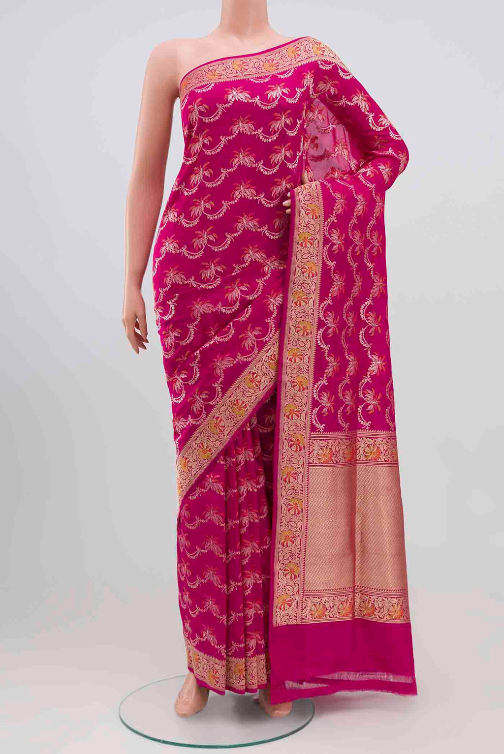 Rani Pink Banarasi Silk Saree with Zari Brocade on the body and Zari Border.  displayed on a mannequin