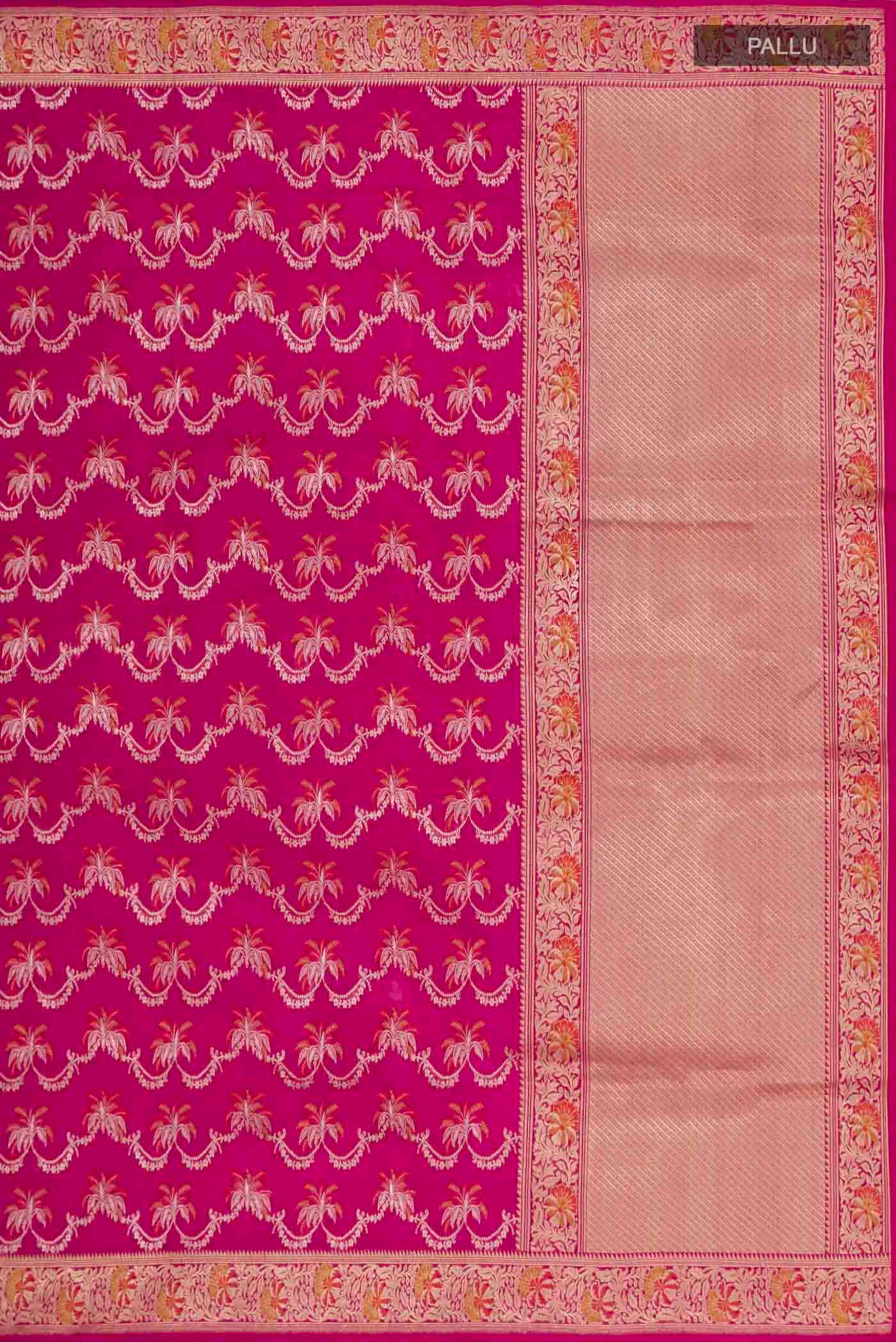 Close up image of the pallu of Rani Pink Banarasi Silk Saree with Zari Brocade on the body and Zari Border. 