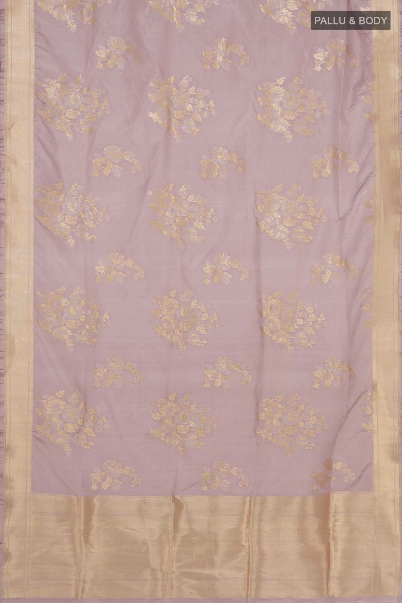Flat view of Lavender Banarasi Silk Saree with Zari Butta on the body and Zari Border. 