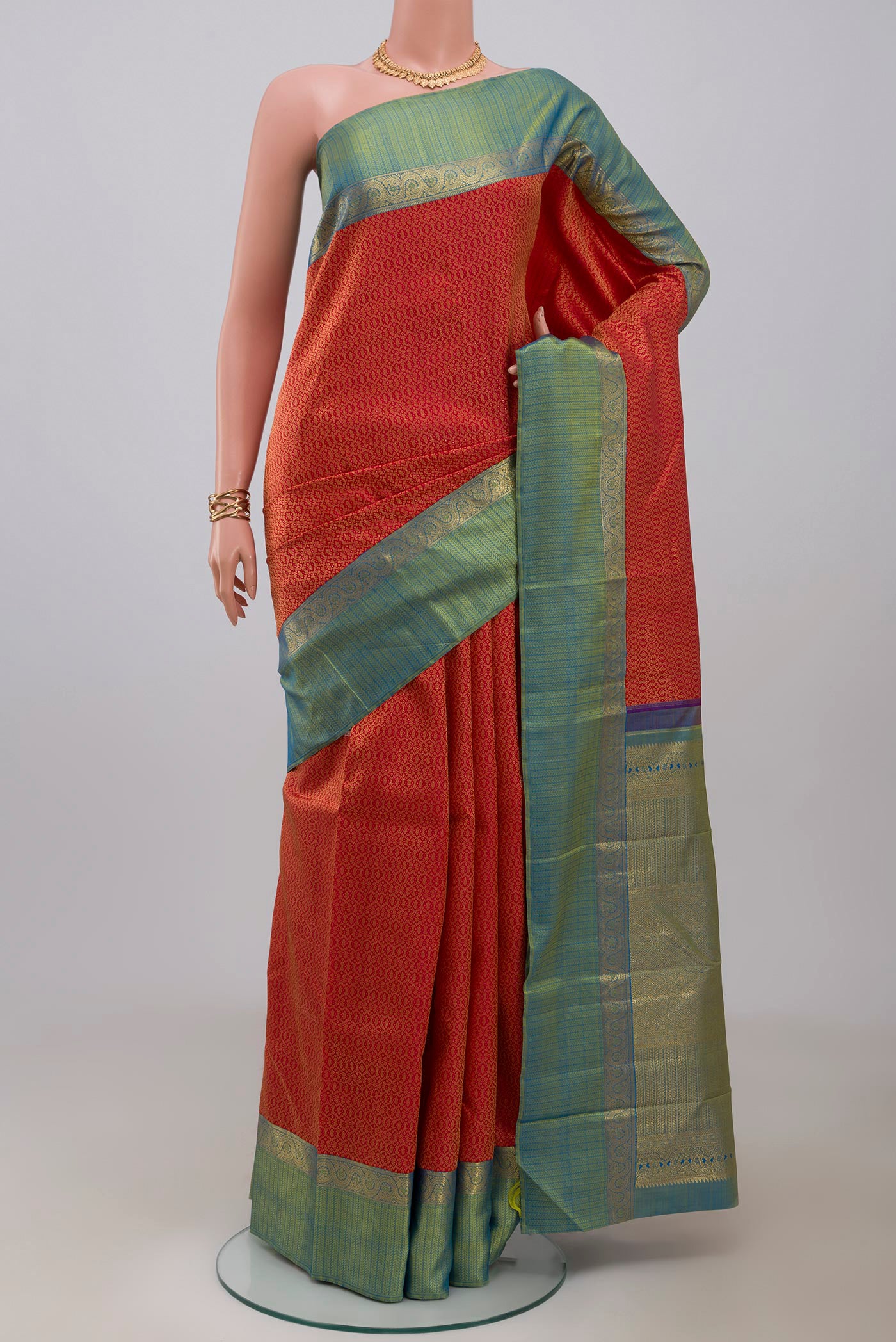 Pure Silk Pure Zari Red Kanchipuram Saree with Jacquard design on the body and Zari Border.  displayed on a mannequin