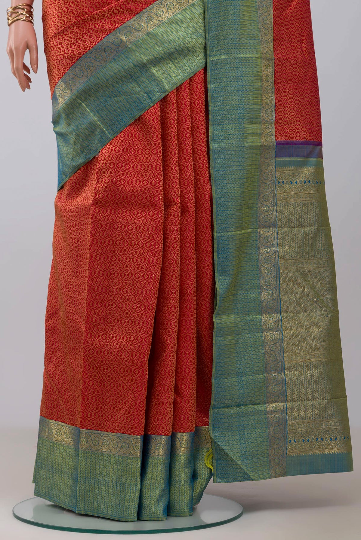 Pleats and pallu of Pure Silk Pure Zari Red Kanchipuram Saree with Jacquard design on the body and Zari Border. 