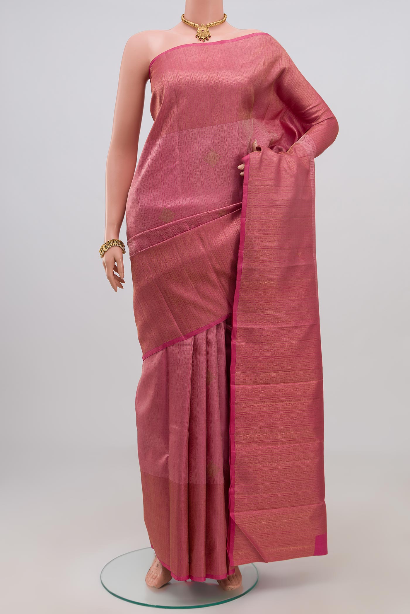 Pure Silk Pure Zari Pink Kanjivaram Saree with Jacquard With Zari Butta on the body and Zari Border.  displayed on a mannequin