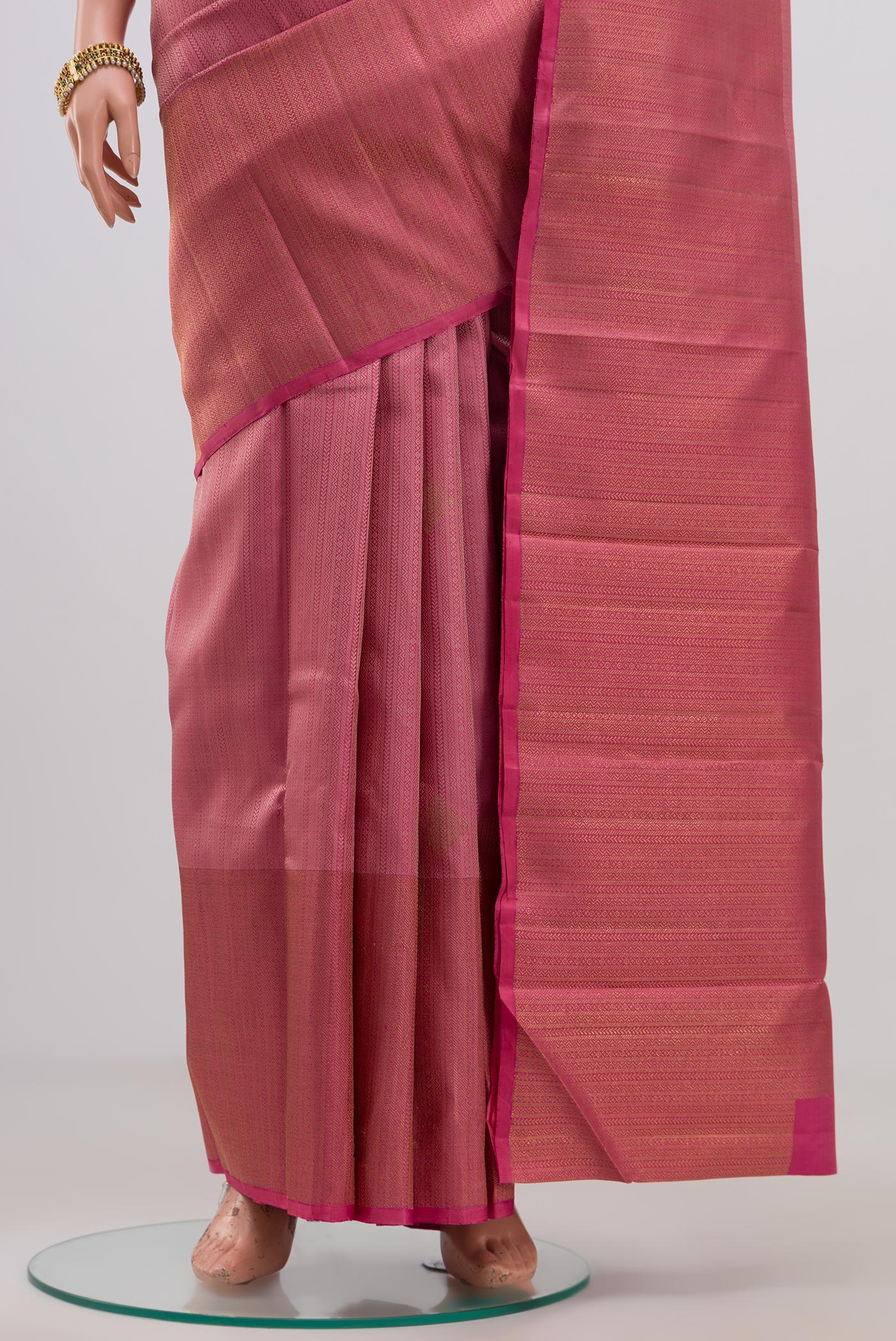 Pleats and pallu of Pure Silk Pure Zari Pink Kanjivaram Saree with Jacquard With Zari Butta on the body and Zari Border. 