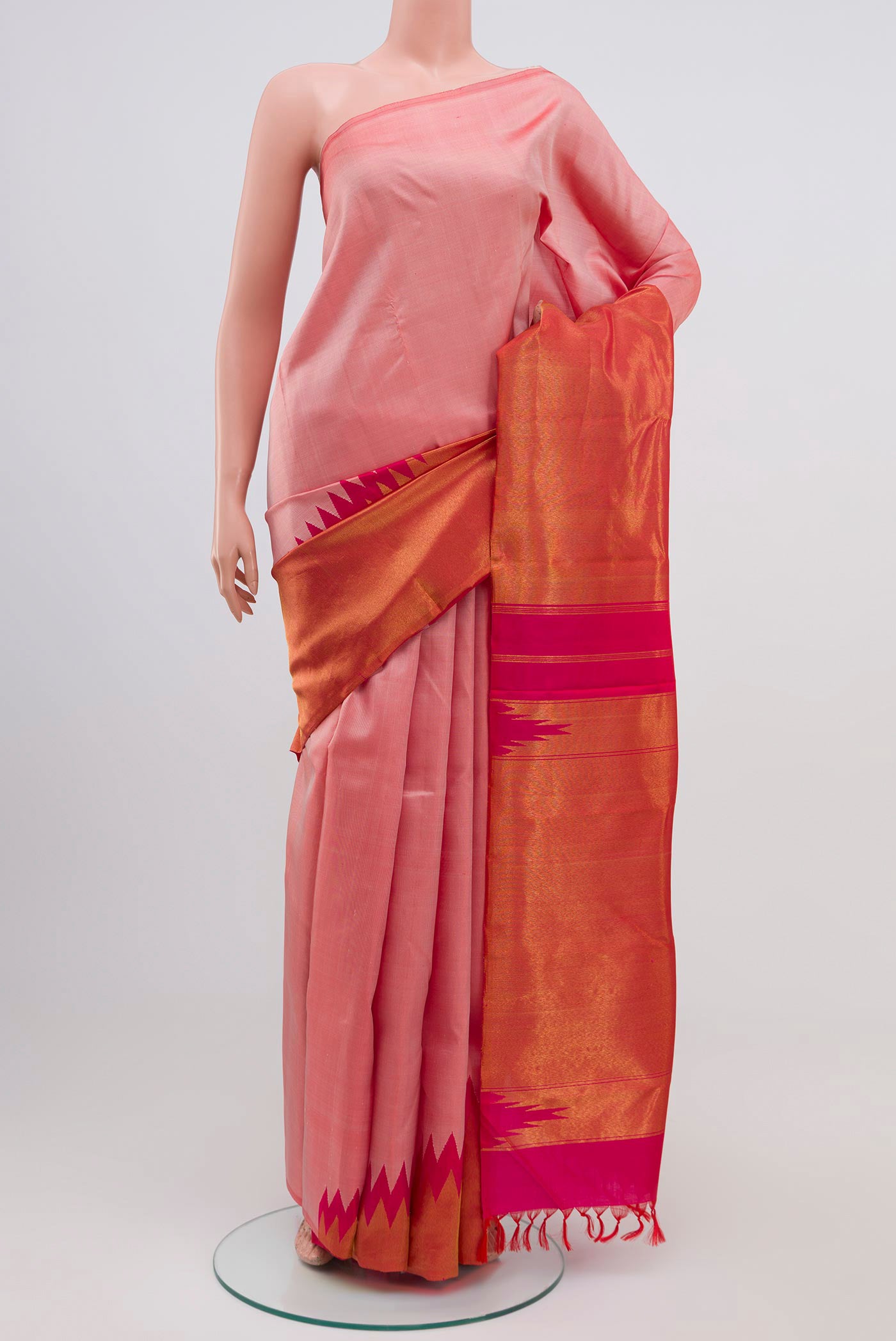 Golden Peach Kanjivaram Silk Saree with Half And Half on the body and Without Border.  displayed on a mannequin