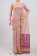 Peach Chanderi Silk Cotton Saree with Zari Butta on the body and Zari Border.  displayed on a mannequin