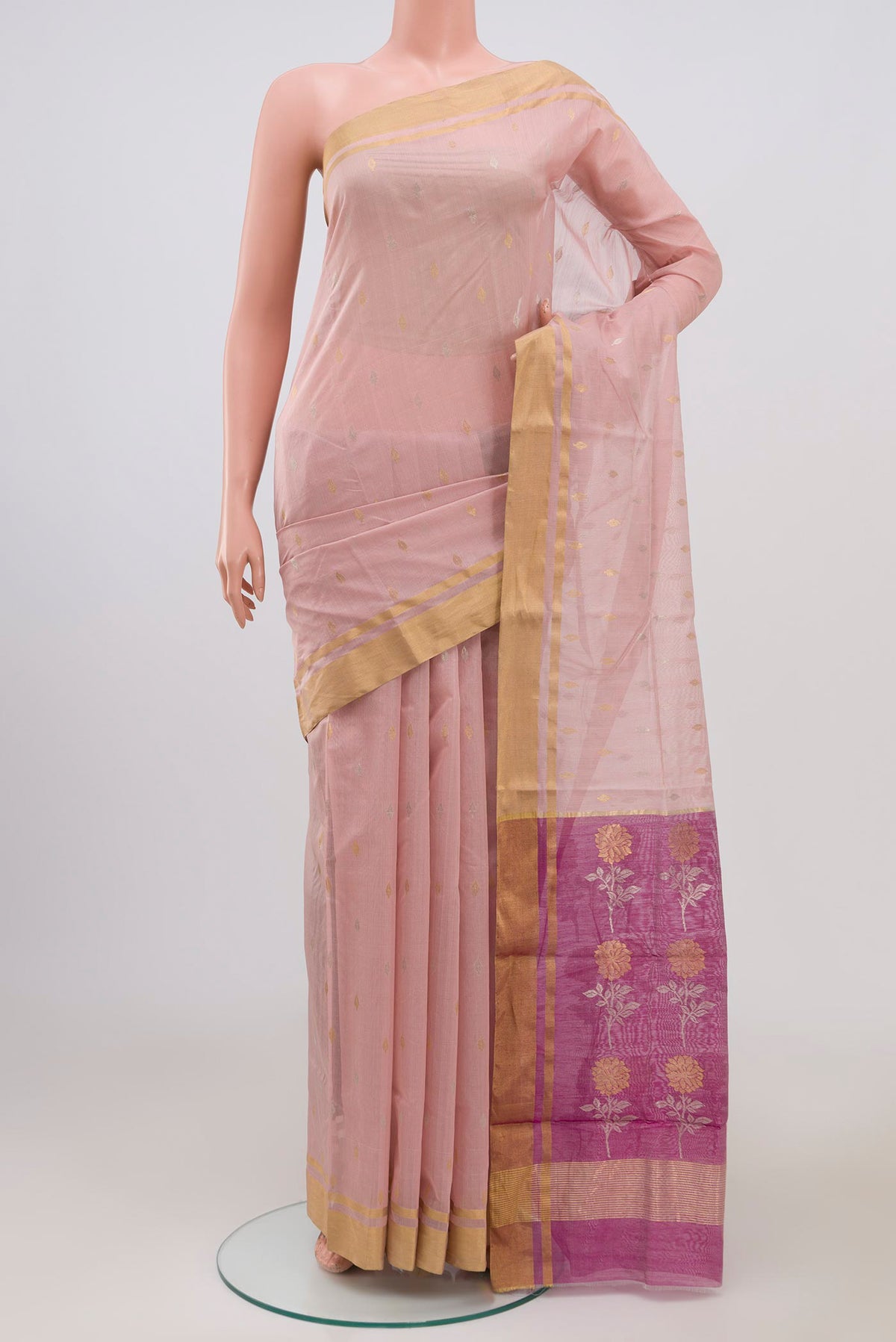 Peach Chanderi Silk Cotton Saree with Zari Butta on the body and Zari Border.  displayed on a mannequin