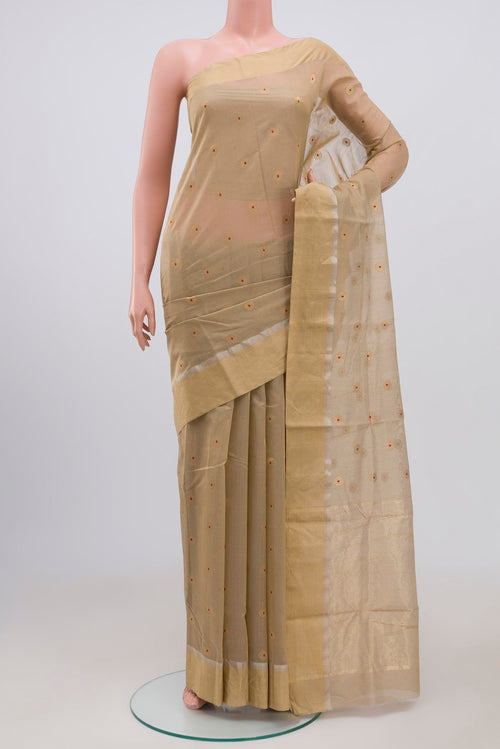 Beige Chanderi Silk Cotton Saree with Zari Butta on the body and Zari Border.  displayed on a mannequin