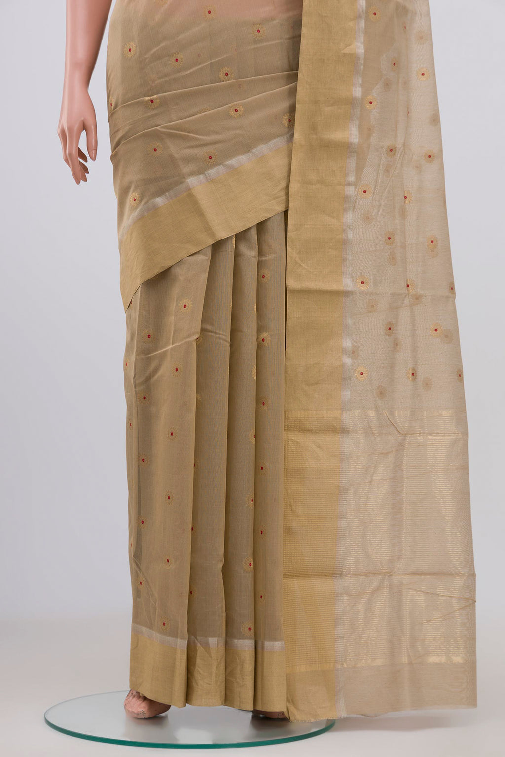 Pleats and pallu of Beige Chanderi Silk Cotton Saree with Zari Butta on the body and Zari Border. 
