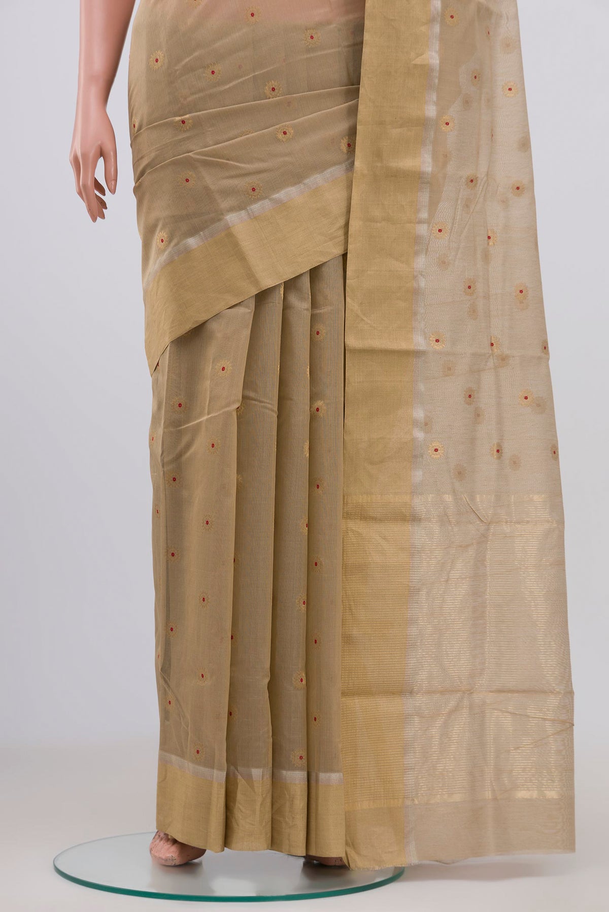 Pleats and pallu of Beige Chanderi Silk Cotton Saree with Zari Butta on the body and Zari Border. 
