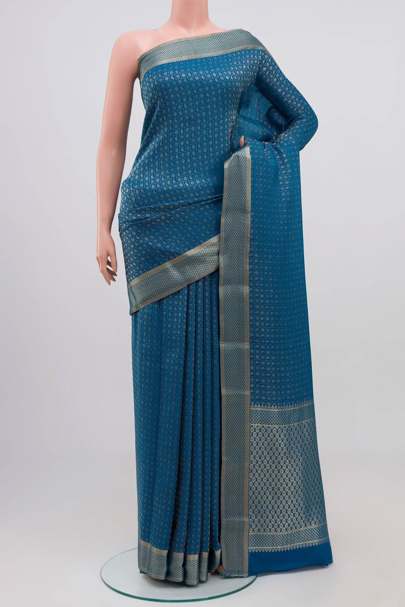 Blue Grey Mysore Crepe Saree with Zari Butta on the body and Zari Border.  displayed on a mannequin