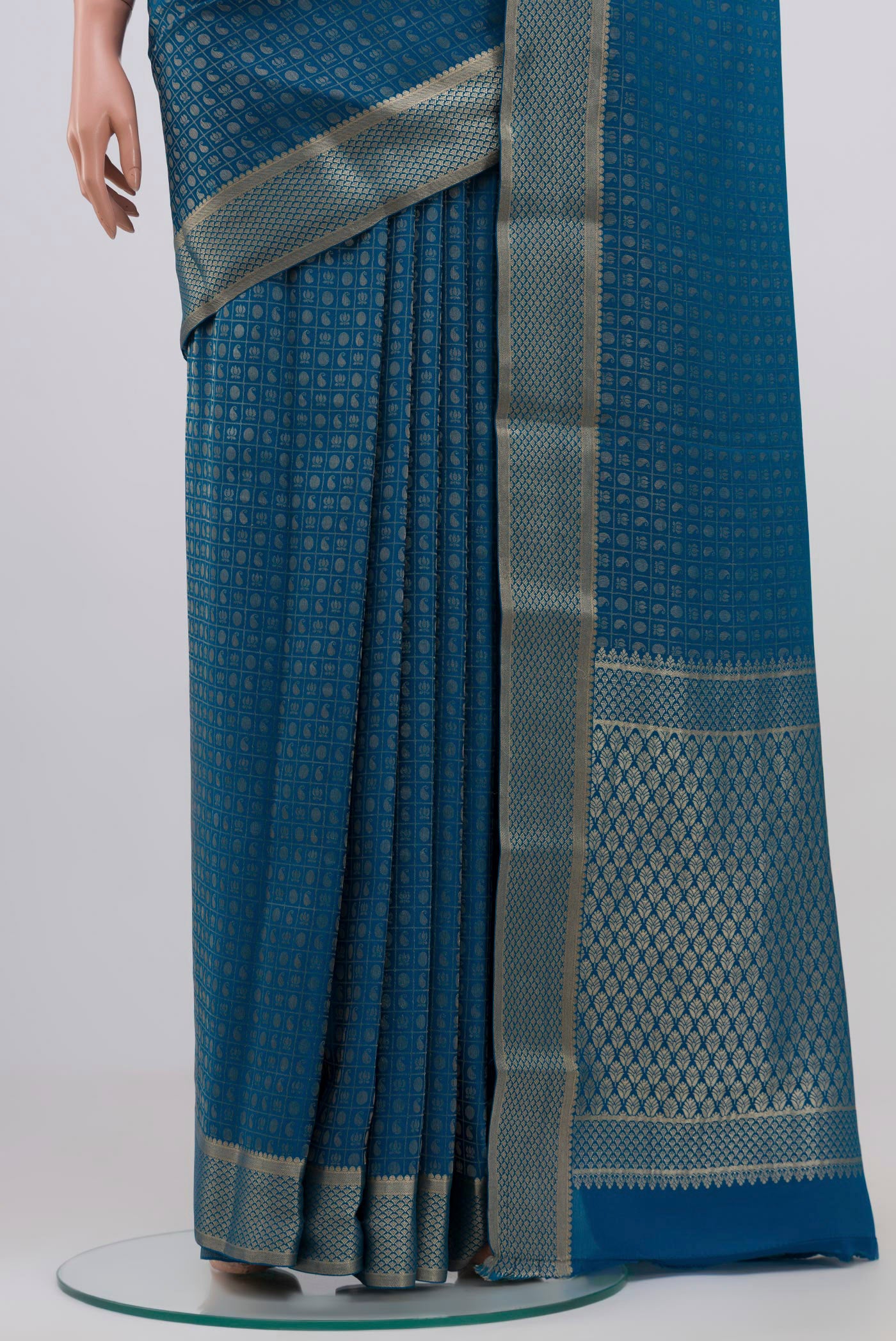 Pleats and pallu of Blue Grey Mysore Crepe Saree with Zari Butta on the body and Zari Border. 