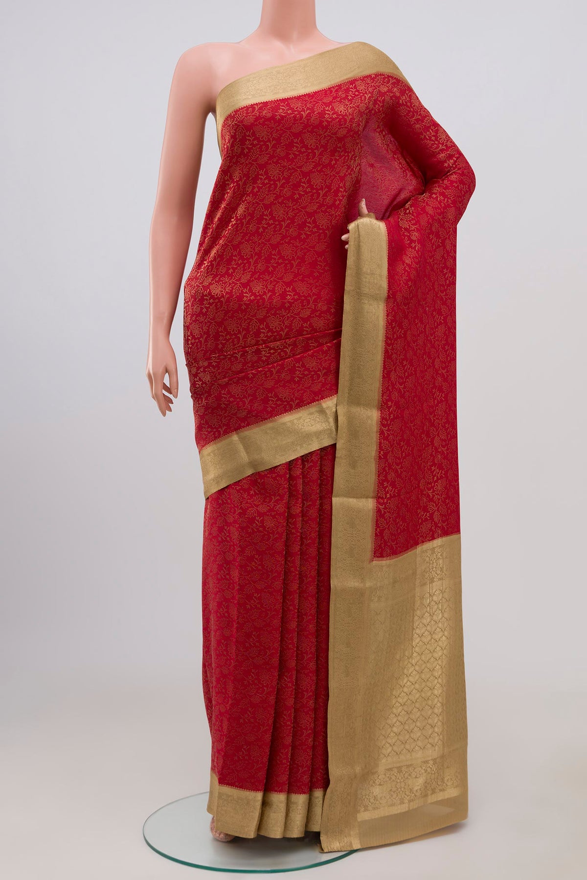 Red Mysore Crepe Saree with Zari Brocade on the body and Zari Border.  displayed on a mannequin