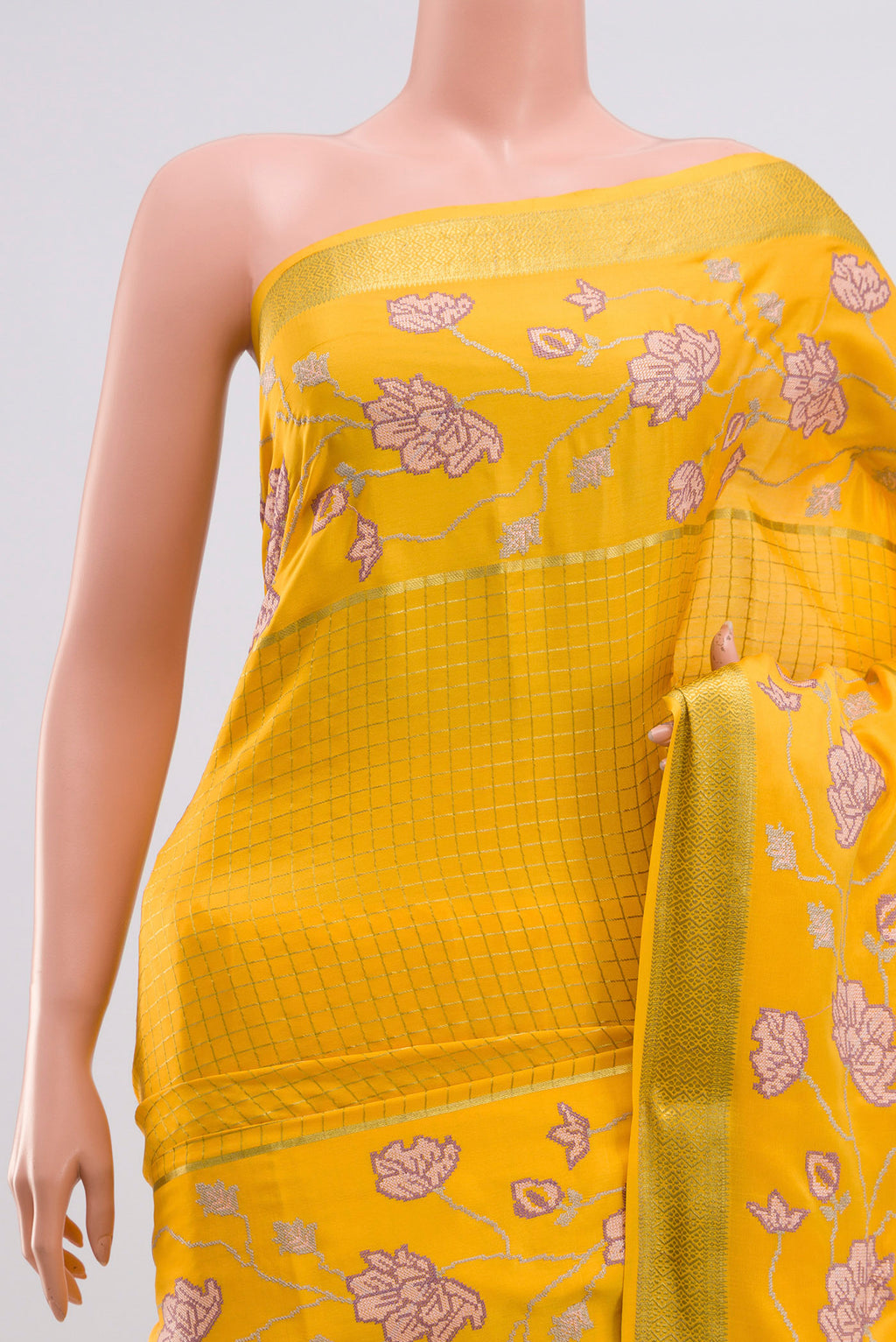 Border image of Yellow Crepe Saree with Checked design on the body and Zari Border. 