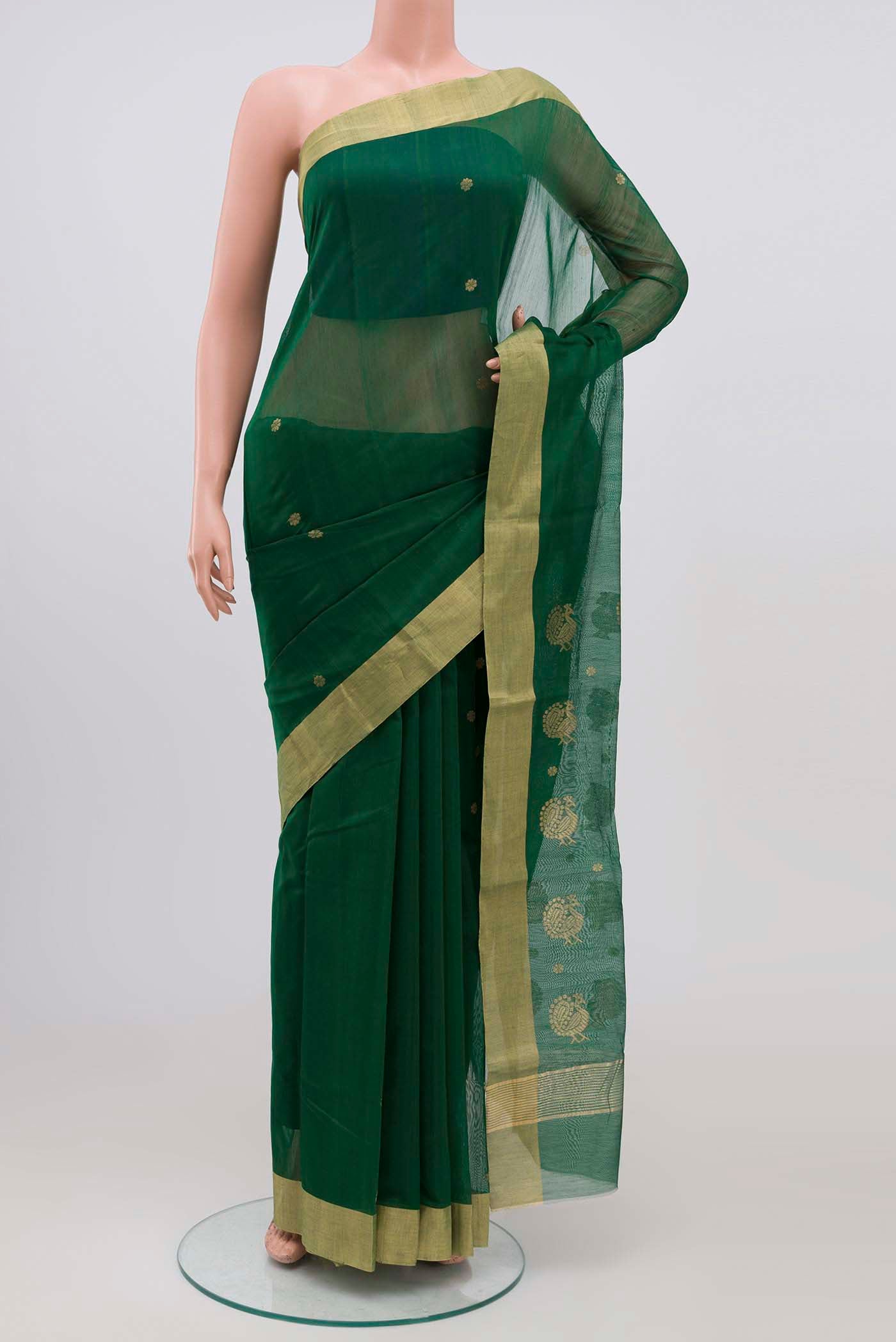 Green Chanderi Silk Cotton Saree with Zari Butta on the body and Zari Border.  displayed on a mannequin