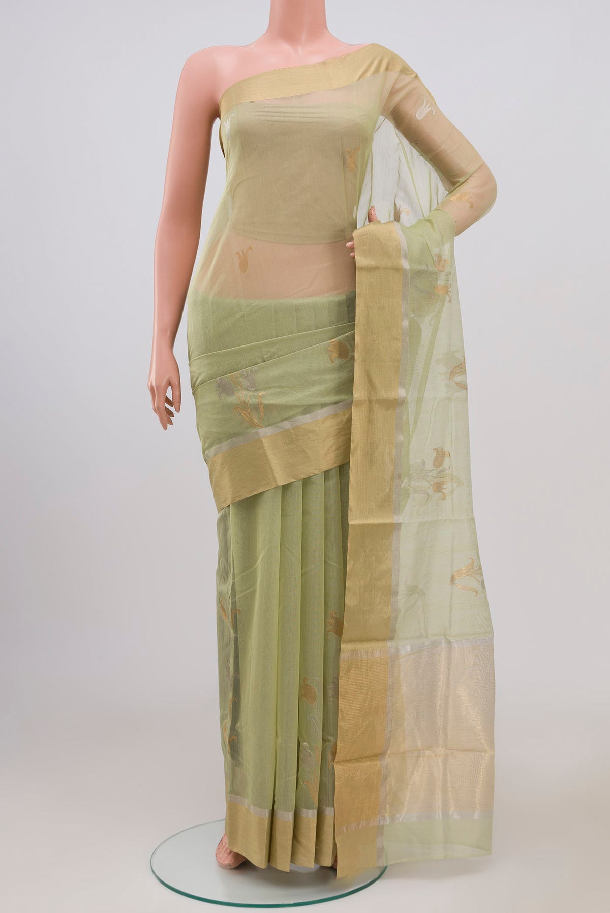 Sea Green Chanderi Silk Cotton Saree with Zari Butta on the body and Zari Border.  displayed on a mannequin