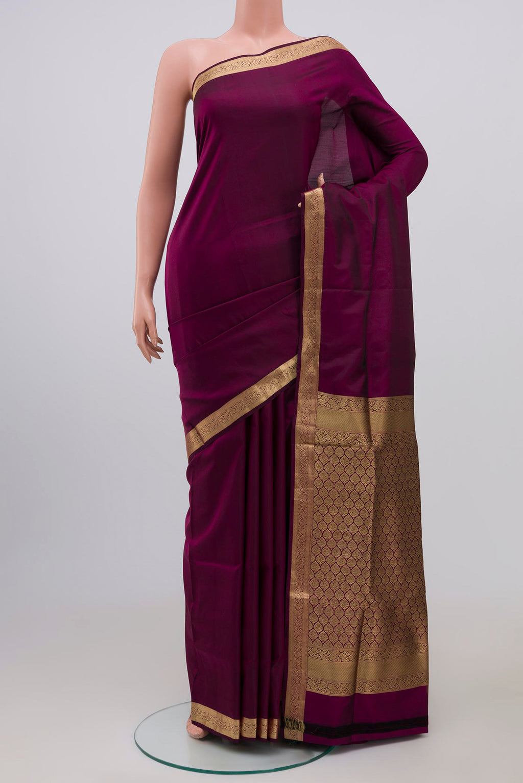 Purple Soft Silk Saree with Plain Body and Zari Border.  displayed on a mannequin