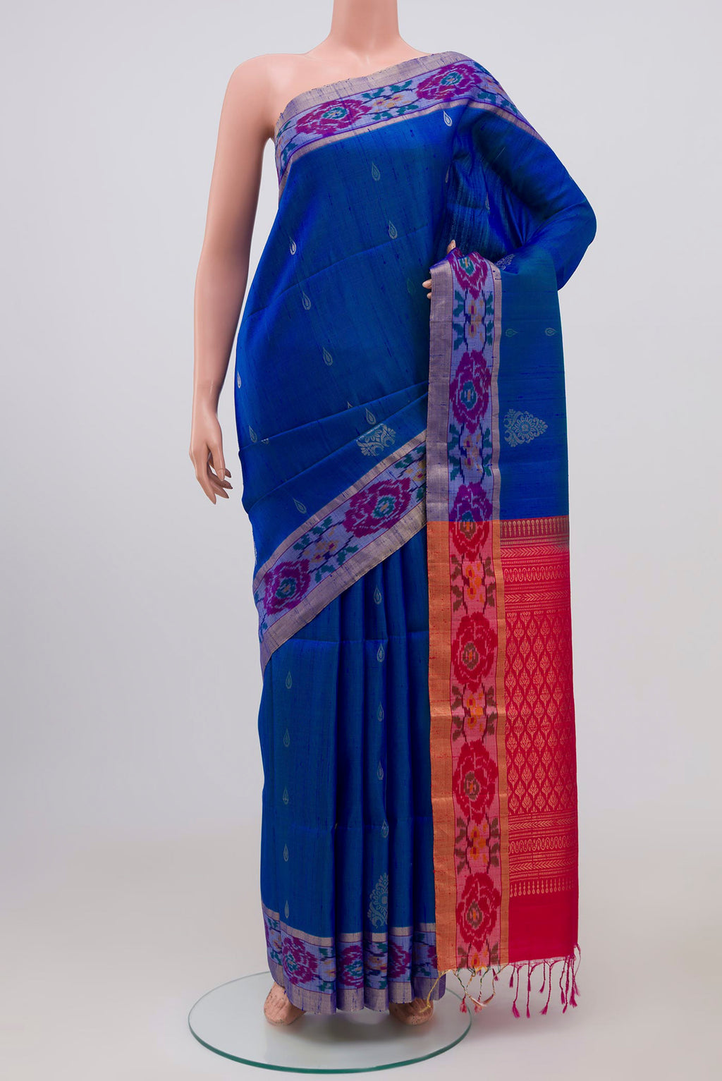 Blue Soft Silk Saree with Zari Butta on the body and Ikat Border.  displayed on a mannequin