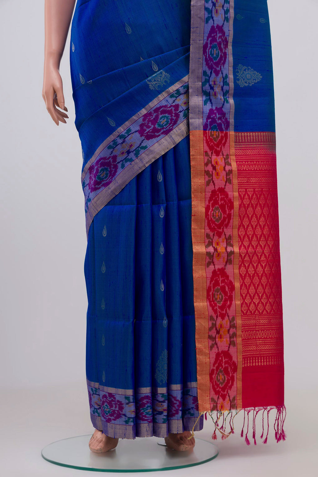 Pleats and pallu of Blue Soft Silk Saree with Zari Butta on the body and Ikat Border. 