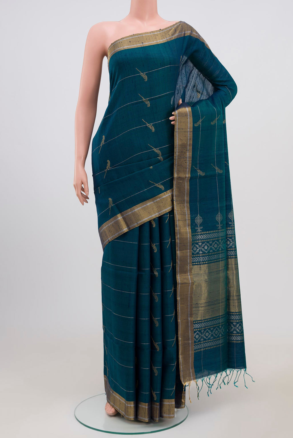 Peacock Blue Soft Silk Saree with Zari Butta on the body and Zari Border.  displayed on a mannequin