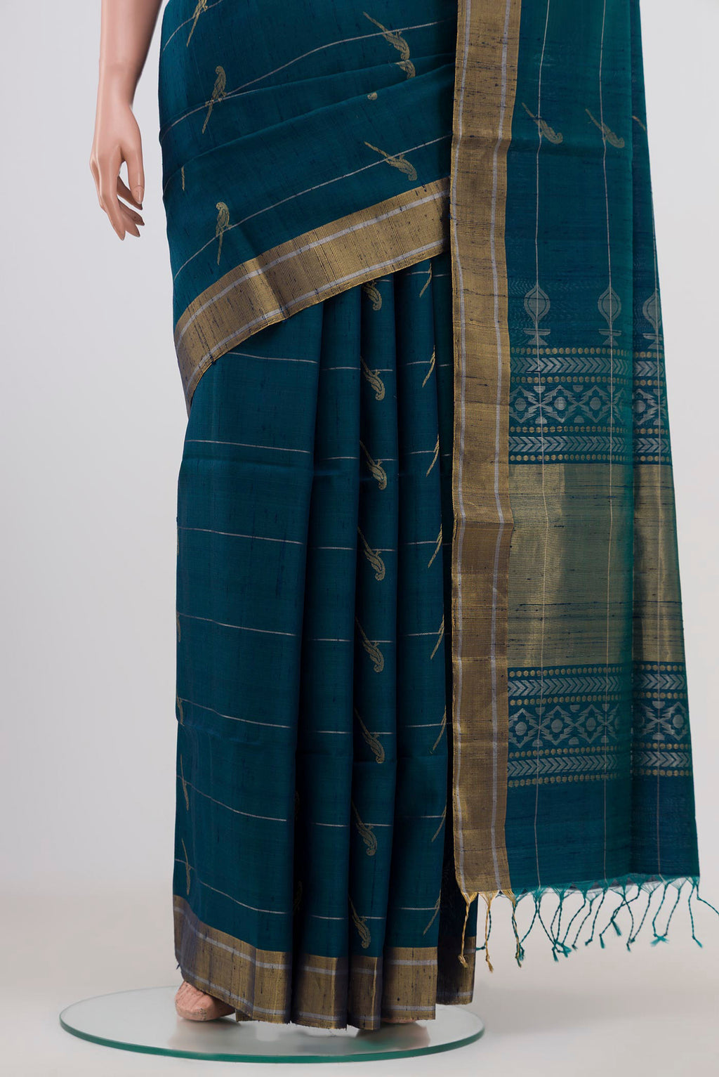 Pleats and pallu of Peacock Blue Soft Silk Saree with Zari Butta on the body and Zari Border. 