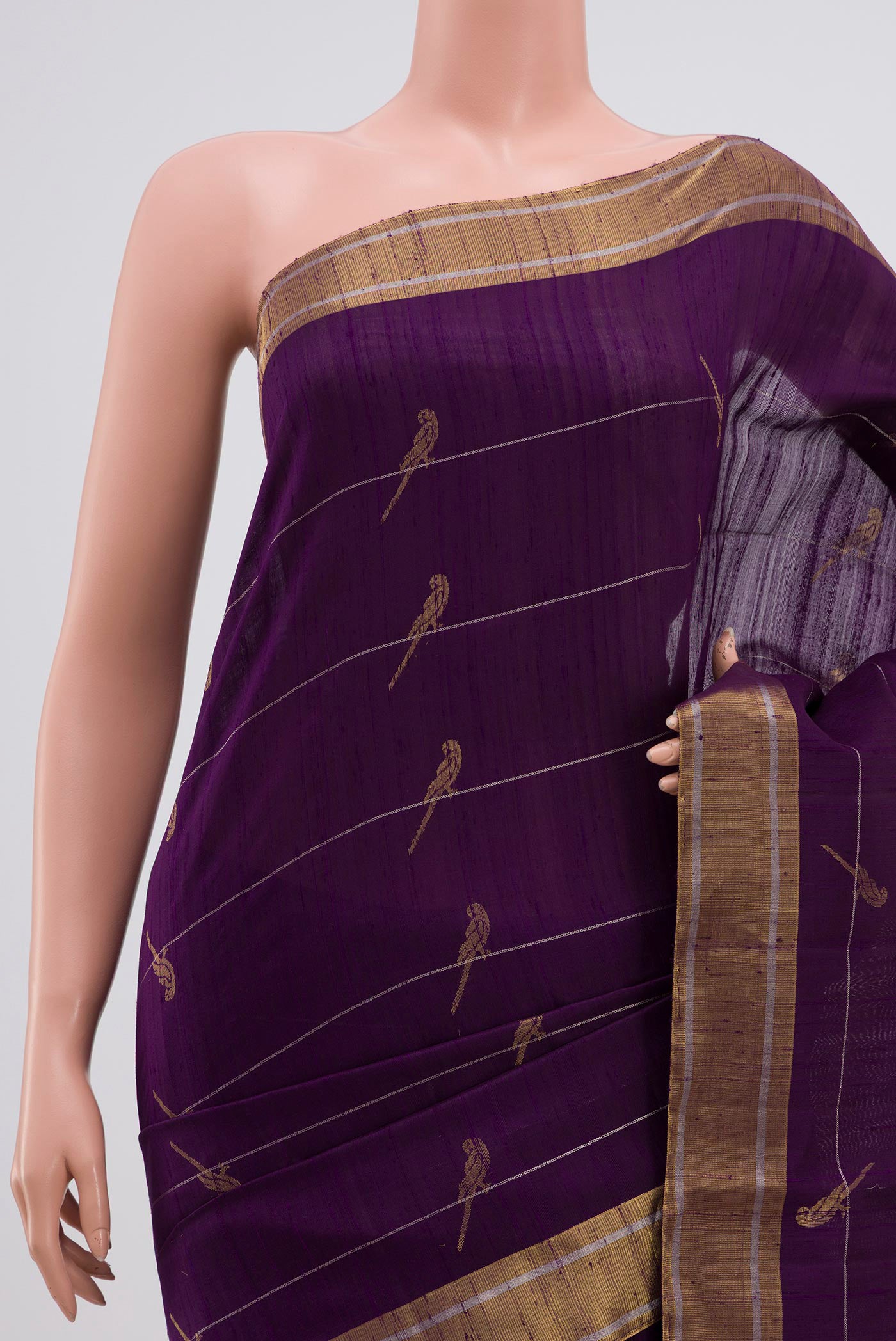 Border image of Purple Soft Silk Saree with Zari Butta on the body and Zari Border. 