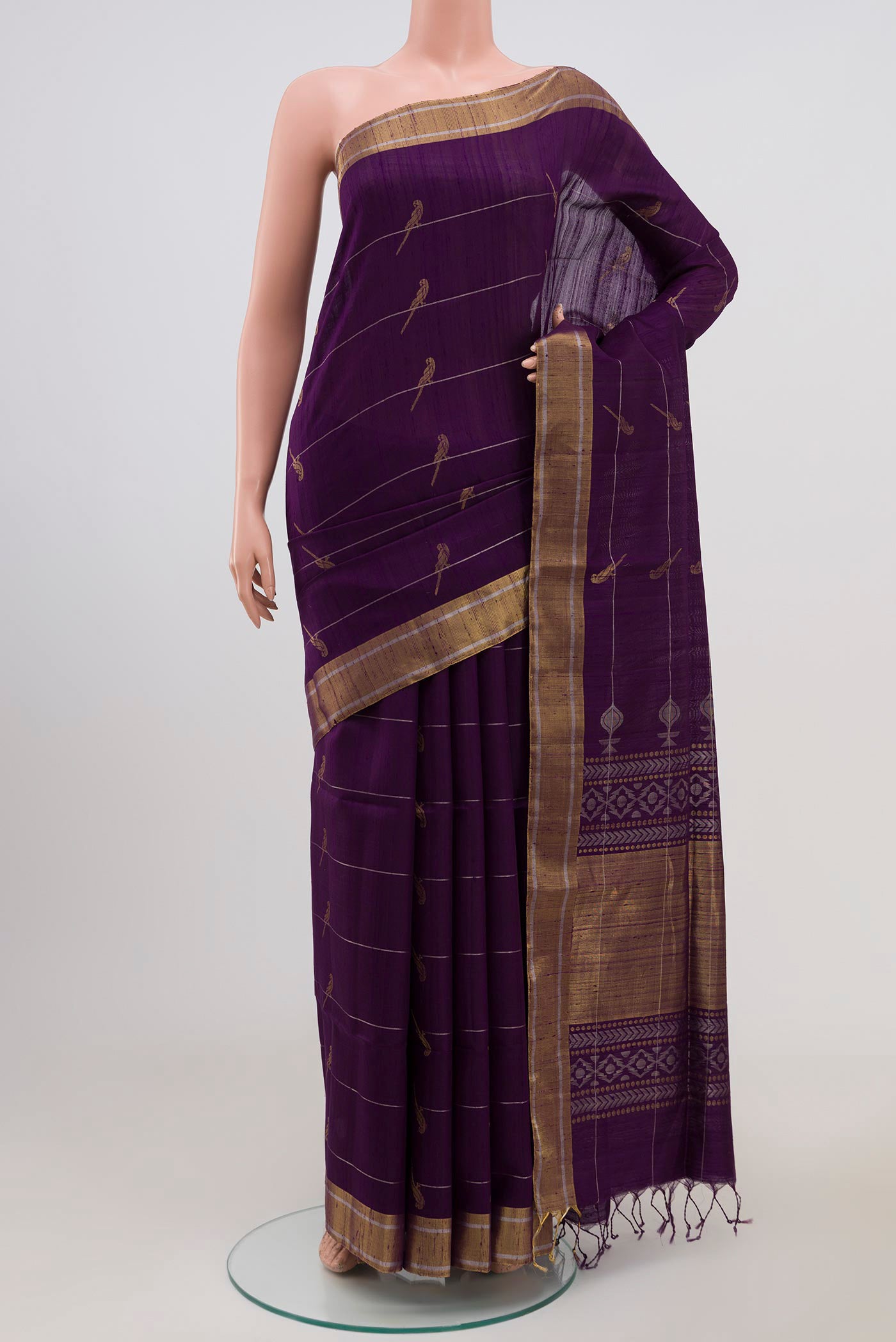 Purple Soft Silk Saree with Zari Butta on the body and Zari Border.  displayed on a mannequin